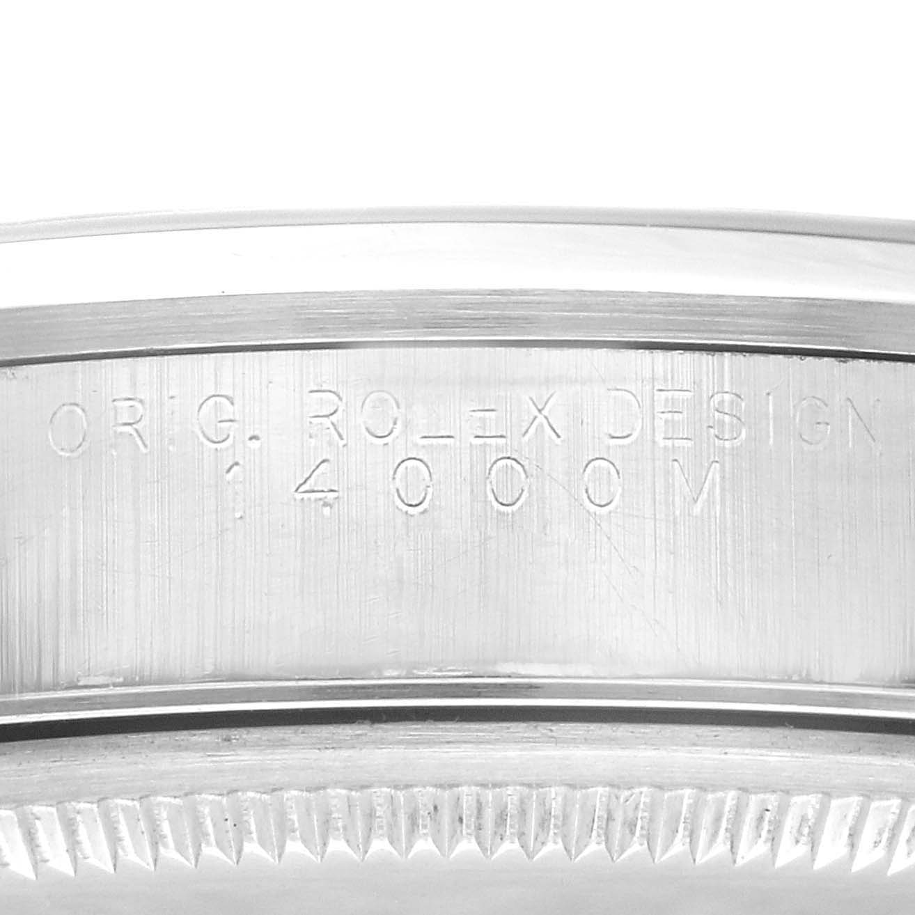 This image shows a close-up view of the engraved side of the bezel and case of a Rolex Air-King 14000 Men's Stainless Steel Silver Dial 14000 Men's Stainless Steel Silver Dial watch.