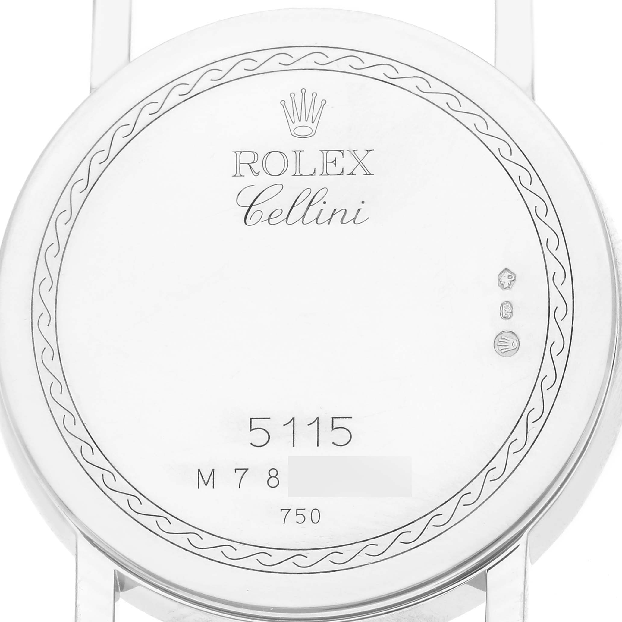 The image shows the back of a Rolex Cellini men
s watch, model number 5115/9, featuring engravings and hallmarks.