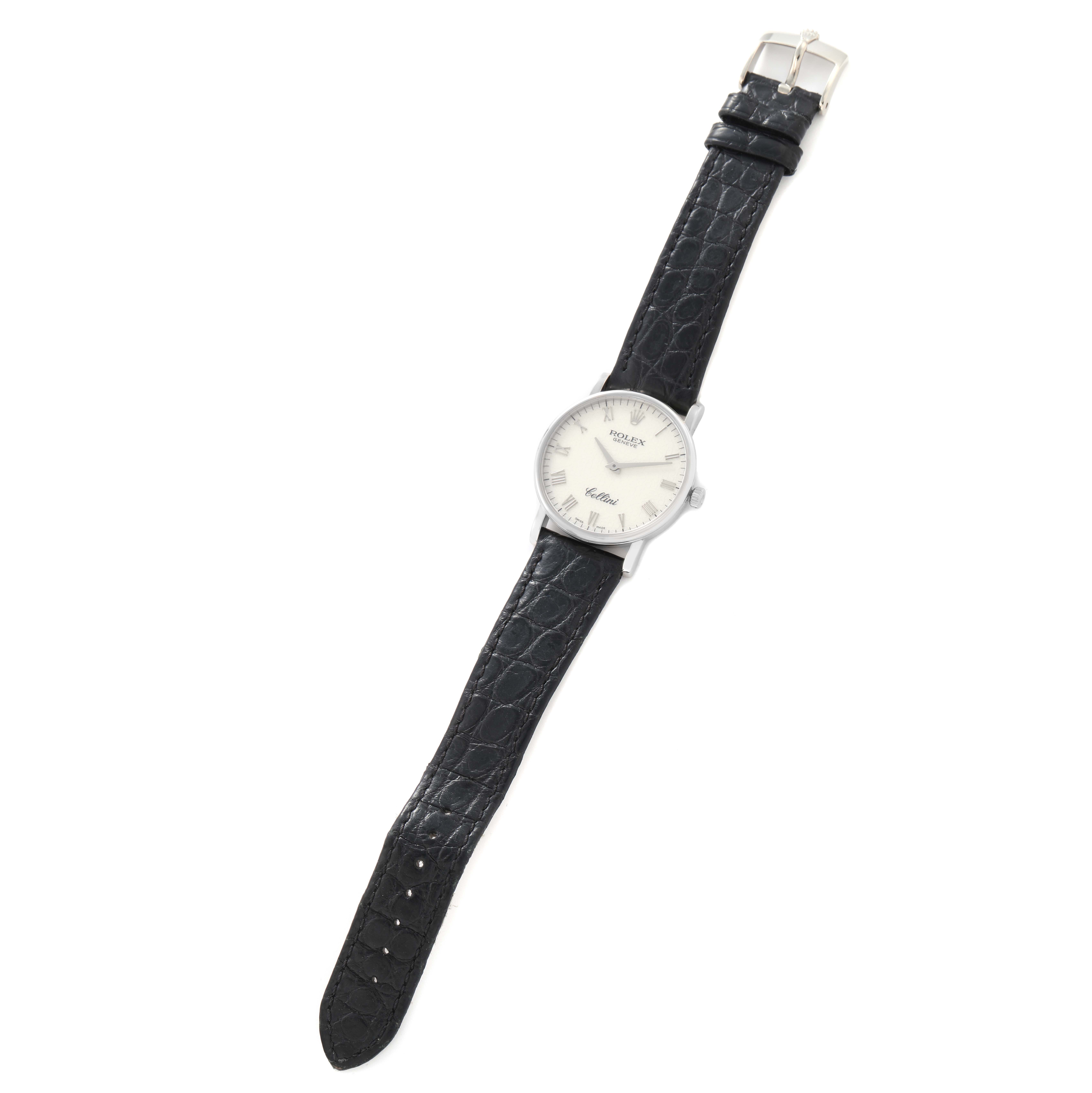 The Rolex Cellini model 5115/9 men
s watch is shown from a top-down angle, displaying its face, leather strap, and buckle.