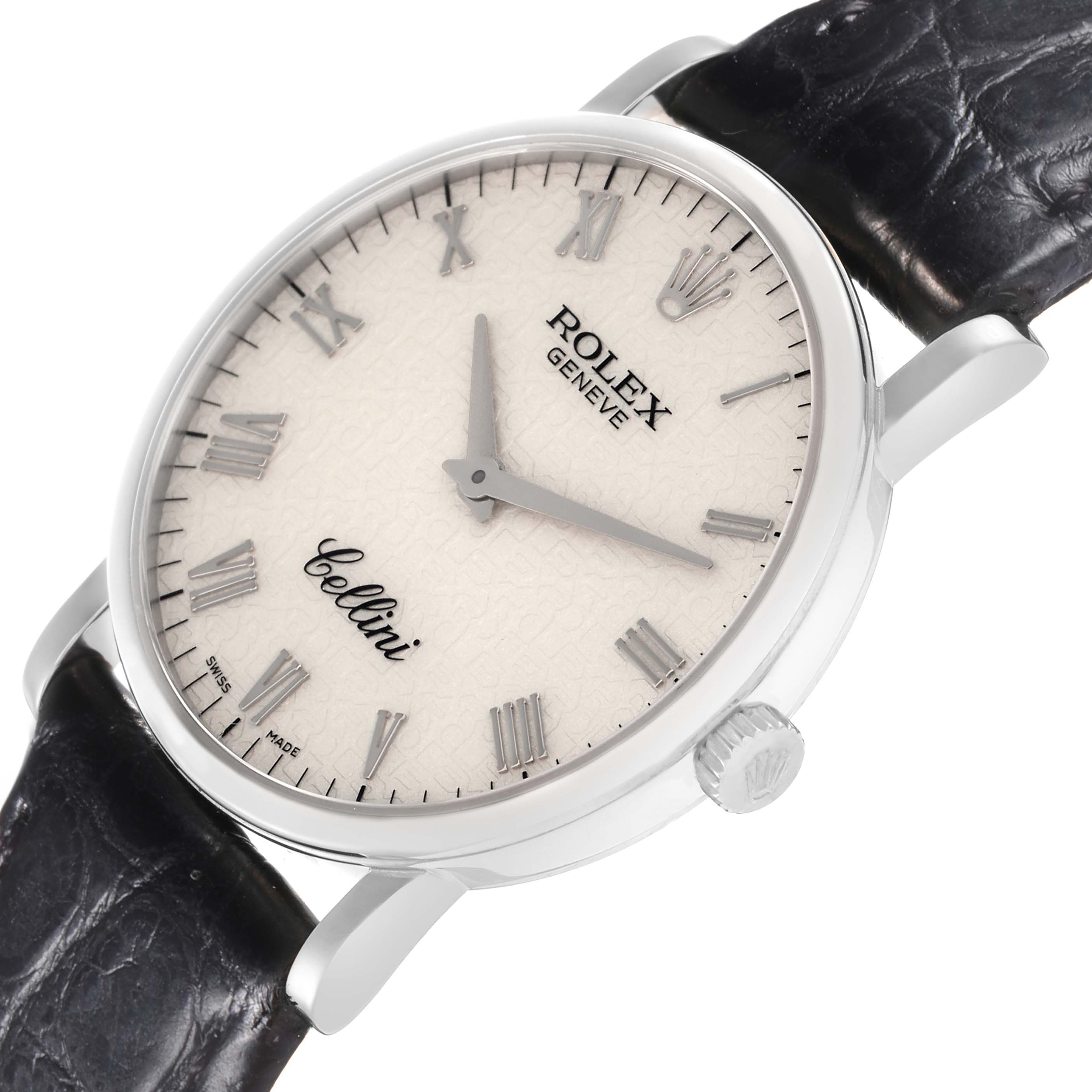 The Rolex Cellini model 5115/9 watch is shown at a slight angle, featuring its face, Roman numeral markers, hands, crown, and part of the black leather strap.