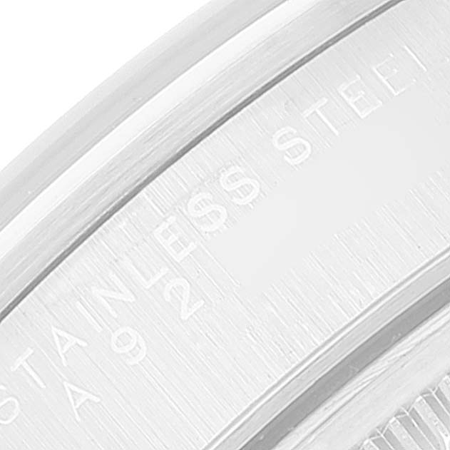 The image shows a close-up of the inner rim and engraving of the stainless steel case of a Rolex Date 15200 Men's Stainless Steel Blue Dial 15200 Men's Stainless Steel Blue Dial model watch.