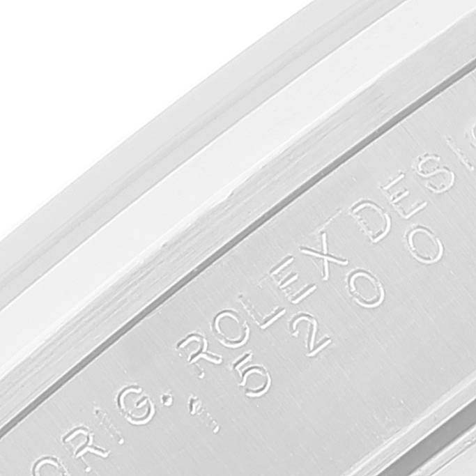 This image shows a close-up of the engraved side of a Rolex Date 15200 Men's Stainless Steel Blue Dial 15200 Men's Stainless Steel Blue Dial model watch casing.