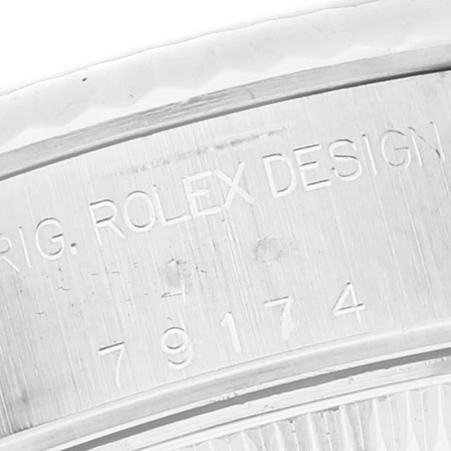 This is a close-up shot of the engraving on the case side of a Rolex Datejust 79174 Women's Stainless Steel Black Dial 79174 Women's Stainless Steel Black Dial watch.