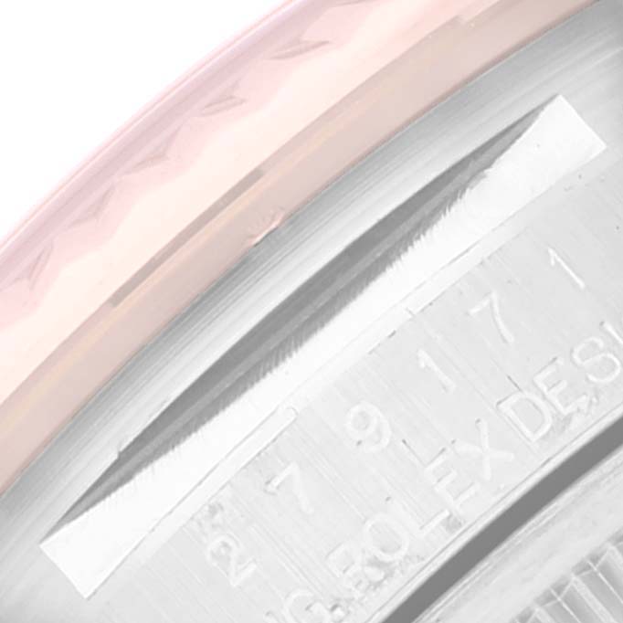 This close-up image shows the engraved inner bezel and part of the case of the Rolex Datejust 279171 Women's Steel and Gold (two tone) Silver Dial 279171 Women's Steel and Gold (two tone) Silver Dial watch.