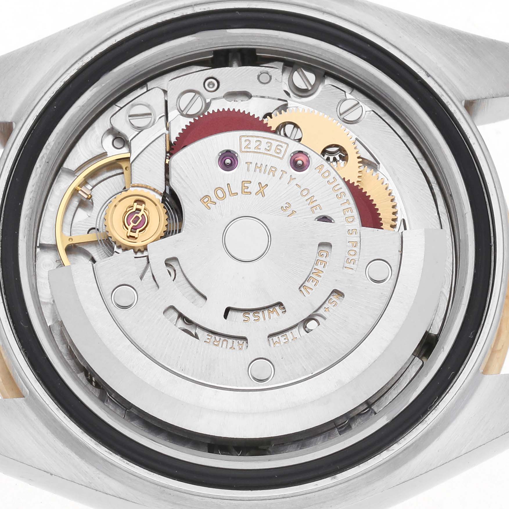The image shows the internal mechanism of a Rolex Datejust model 279173 men
s watch from a back angle, highlighting its intricate components and engravings.