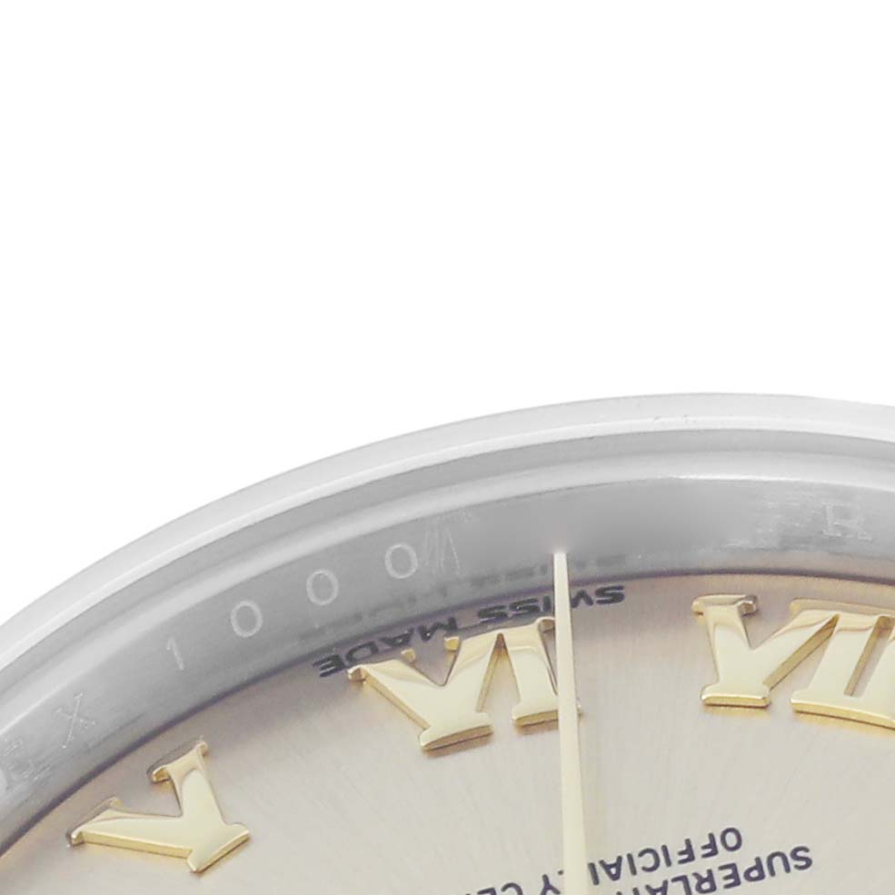 The image shows a close-up detail of the Rolex Datejust model 279173, focusing on the watch
s dial with gold Roman numerals and part of the bezel.