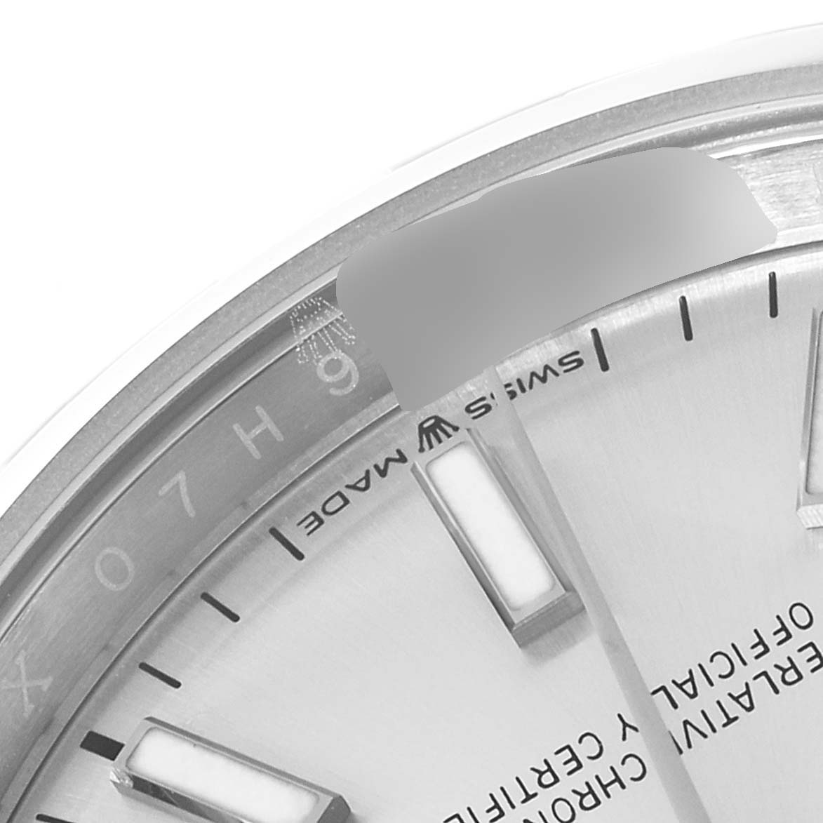 This close-up image shows the dial, part of the sapphire crystal, and hour markers of the Rolex Datejust 126200 Men's Stainless Steel Silver Dial 126200 Men's Stainless Steel Silver Dial watch.