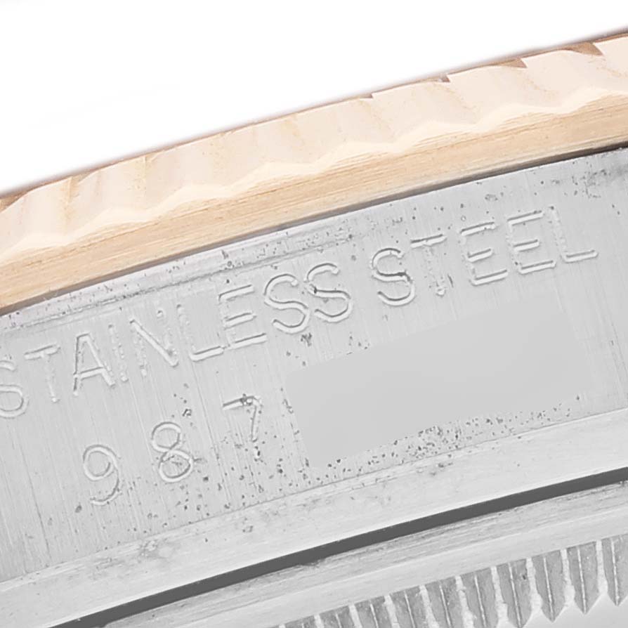 The image shows a close-up of the edge and stainless steel engraving on the Rolex Vintage Collection 16013 Men's Steel and Gold (two tone) Black Dial 16013 Men's Steel and Gold (two tone) Black Dial watch.