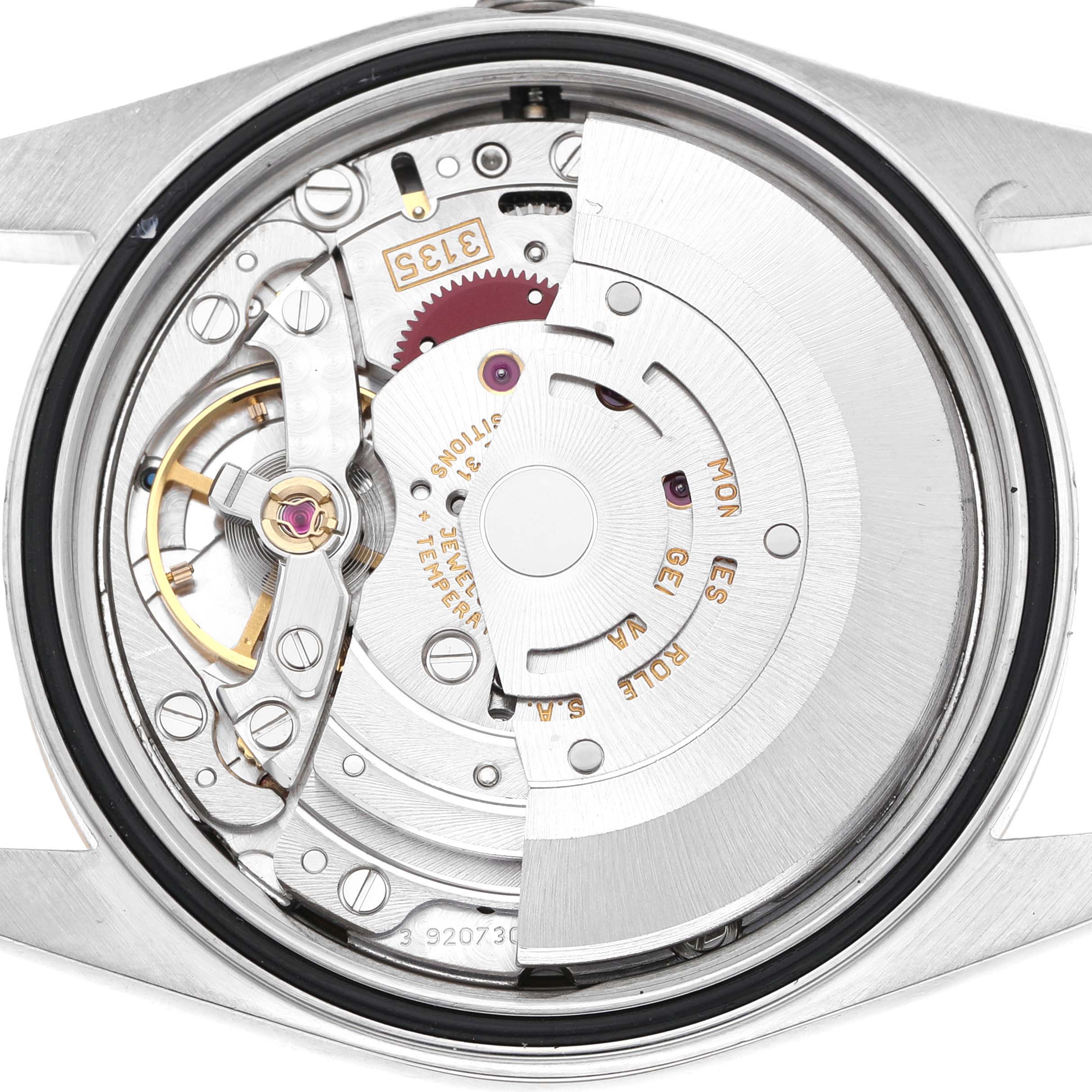 The image shows the movement and intricate components of a Rolex Datejust 16233 Men's Steel and Gold (two tone) White Dial from a top view with the case back removed.