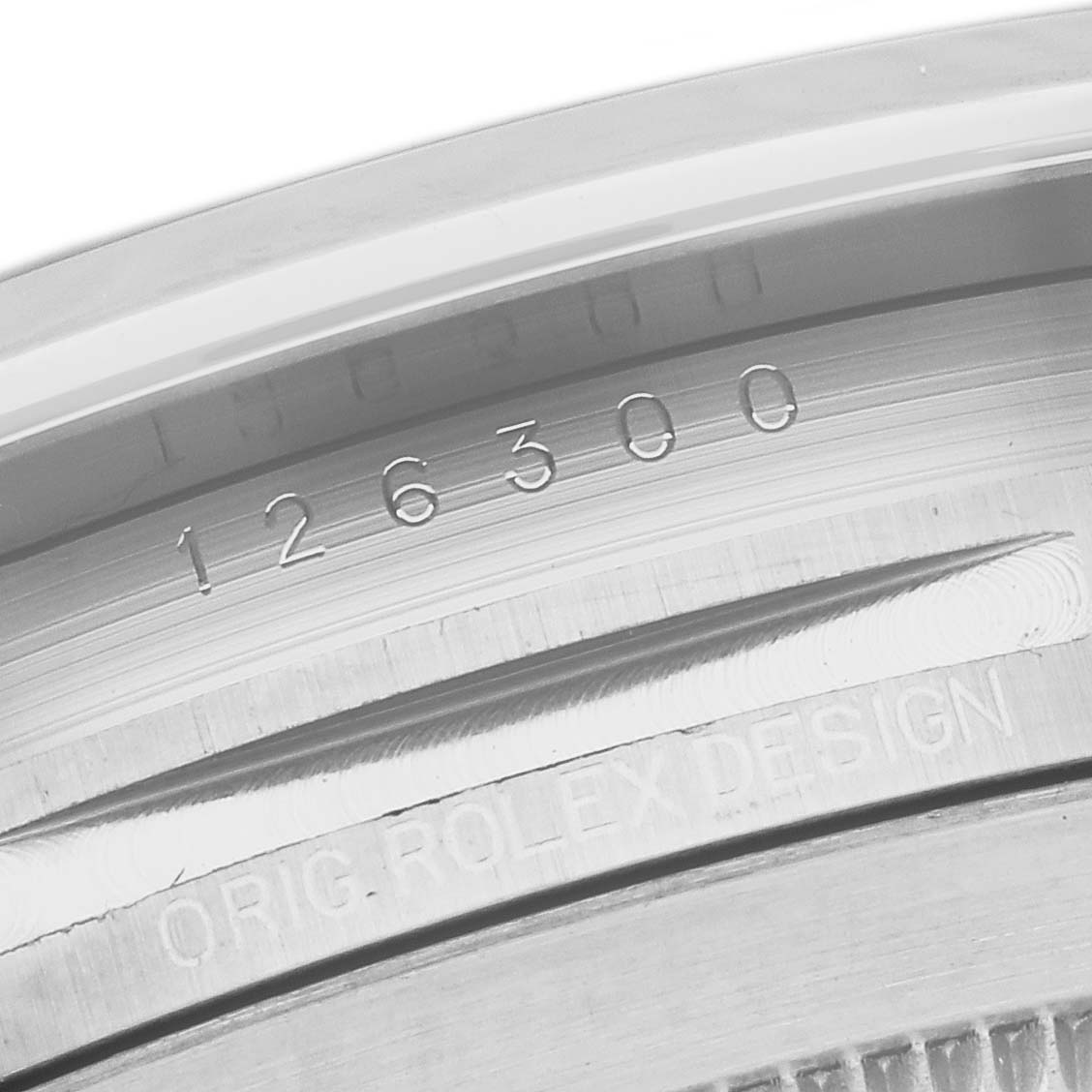 This image shows a close-up of the inner case back of a Rolex Datejust 41 126300 Men's Stainless Steel Green Dial 126300 Men's Stainless Steel Green Dial model, displaying the reference number and "ORIG. ROLEX DESIGN" engraving.