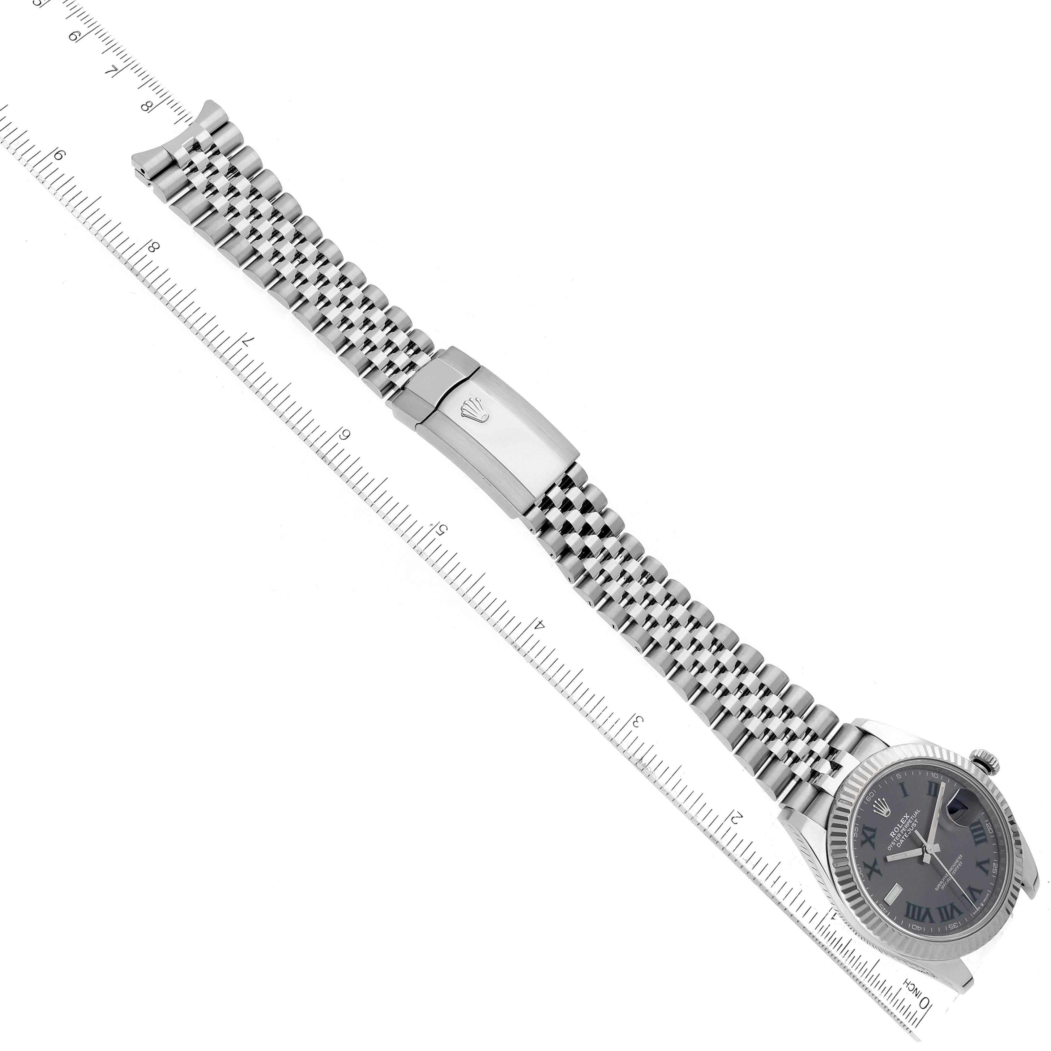 The image shows a Rolex Datejust 41 126334 Men
s Stainless Steel Grey Dial 126334 Men
s Stainless Steel Grey Dial watch laying flat with its bracelet extended and a ruler beside it for measurement.