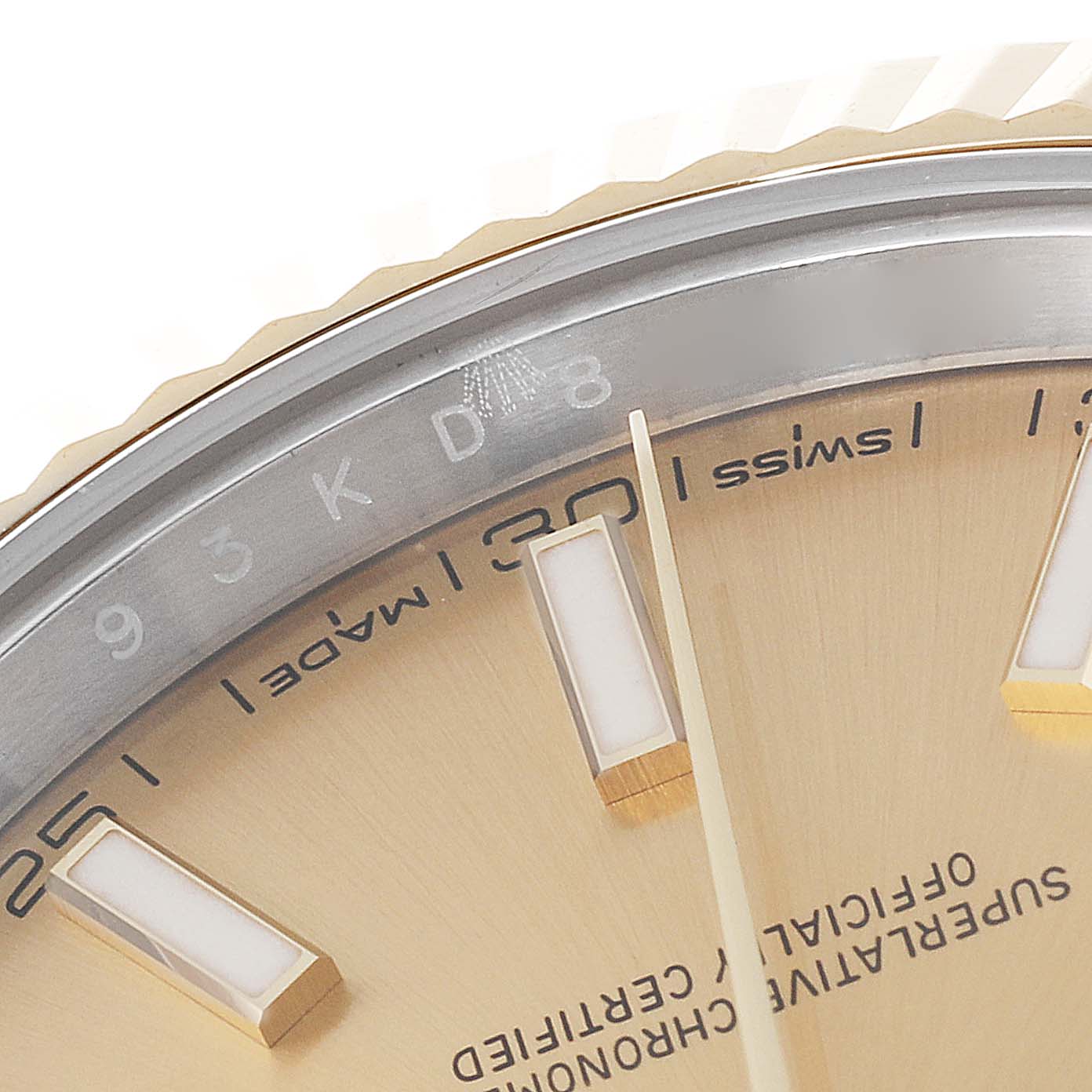 This close-up image shows the dial and part of the bezel of the Rolex Datejust 41 126333 Men's Steel and Gold (two tone) Champagne Dial 126333 Men's Steel and Gold (two tone) Champagne Dial watch, highlighting the "Swiss made" text and some hour markers.