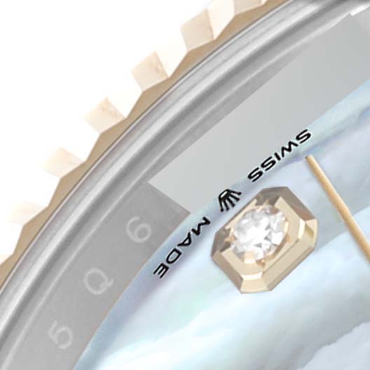 This is a close-up of the Rolex Datejust 41 126333 Men's Steel and Gold (two tone) Mother of Pearl Dial 126333 Men's Steel and Gold (two tone) Mother of Pearl Dial watch, showcasing part of the bezel, dial, and a diamond hour marker.
