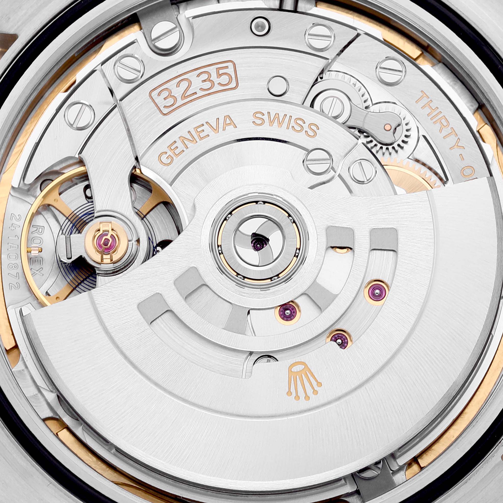 The image shows a close-up view of the movement inside a Rolex Datejust 41 126333 Men's Steel and Gold (two tone) Mother of Pearl Dial 126333 Men's Steel and Gold (two tone) Mother of Pearl Dial watch, highlighting the intricate mechanisms.