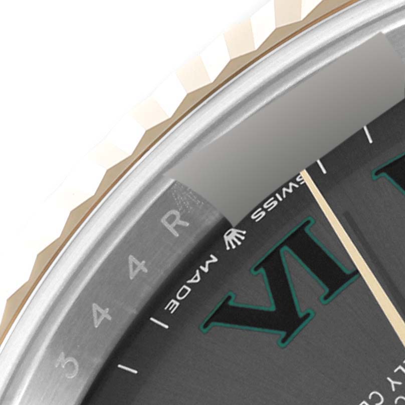 This close-up of the Rolex Datejust 41 126333 Men's Steel and Gold (two tone) Grey Dial 126333 Men's Steel and Gold (two tone) Grey Dial showcases the edge of the dial, fluted bezel, and part of the Roman numeral hour markers.