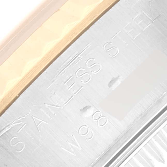 This close-up image shows the engraved details on the side of the bezel and case of a Rolex Datejust 69173 Women's Steel and Gold (two tone) Blue Dial 69173 Women's Steel and Gold (two tone) Blue Dial watch.