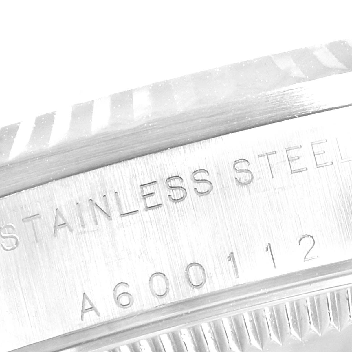 The image shows a close-up of the stainless steel case side and bezel edge of a Rolex Mid-Size 78274 Women
s Stainless Steel Black Dial 78274 Women
s Stainless Steel Black Dial watch.