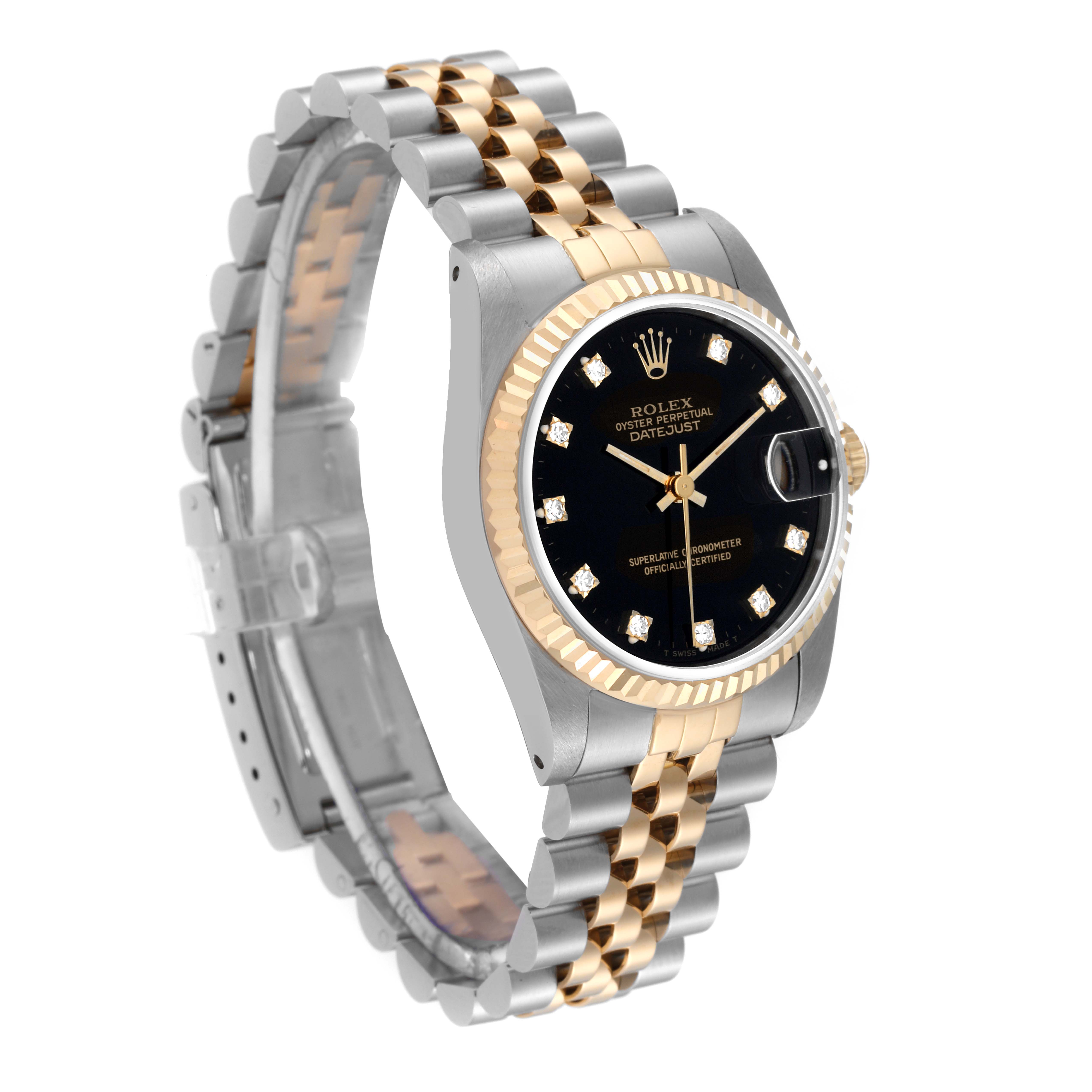 This Rolex Mid-Size 68273 Women's Steel and Gold (two tone) Black Dial 68273 Women's Steel and Gold (two tone) Black Dial Datejust watch is shown at a slight angle, highlighting its face, bezel, and two-tone bracelet.