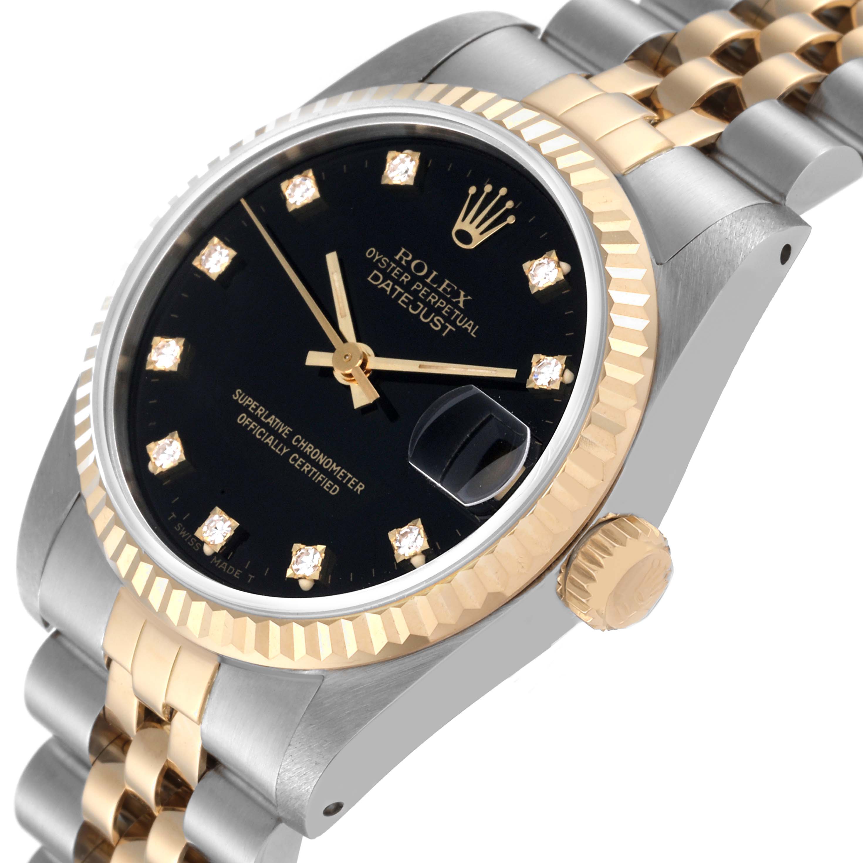 The image shows an angled view of the Rolex Oyster Perpetual Datejust Mid-Size watch displaying its black dial, bezel, and part of the bracelet.
