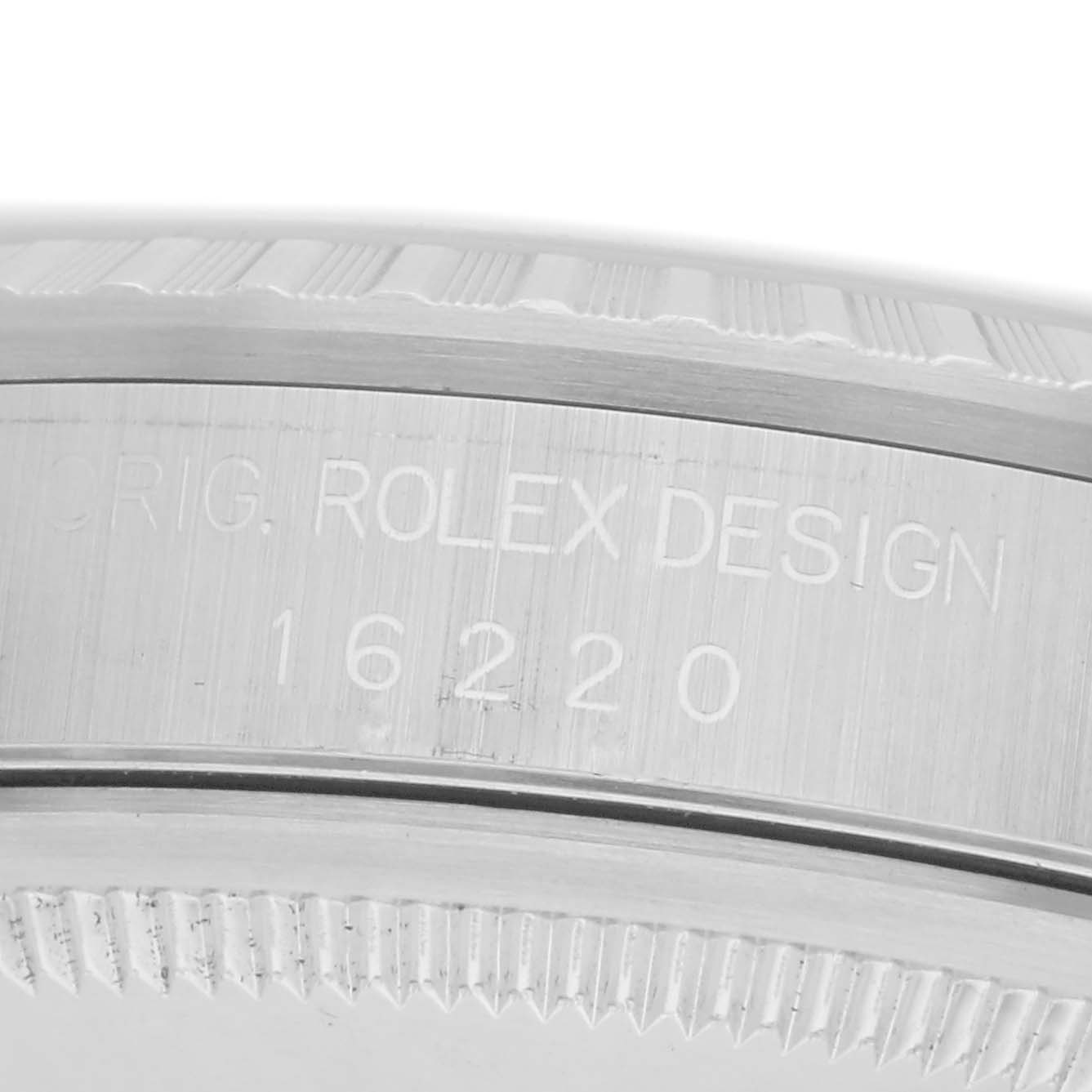 The image shows a close-up side view of the case, displaying the engraving "ORIG. ROLEX DESIGN" and the model number 16220 on the Rolex Datejust watch.
