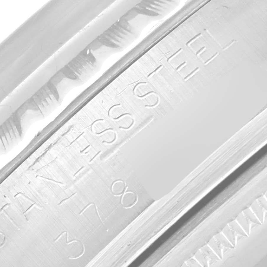 This image shows a close-up of a stainless steel caseback engraving on a Rolex Vintage Collection 1603 Men's Stainless Steel Silver Dial 1603 Men's Stainless Steel Silver Dial watch.