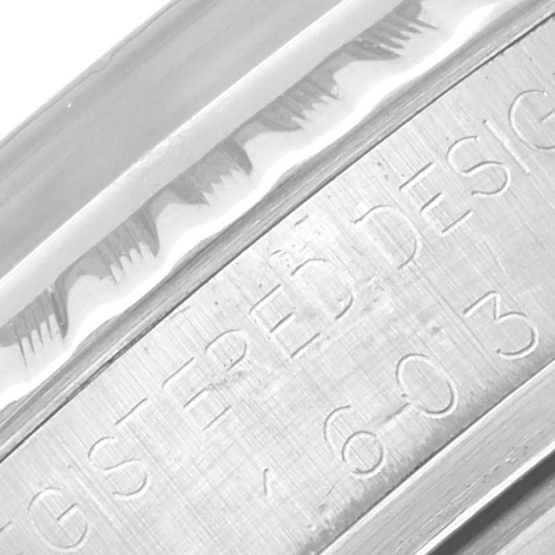 The image shows a close-up of the engraved side of the bezel on a Vintage Collection model by Rolex.