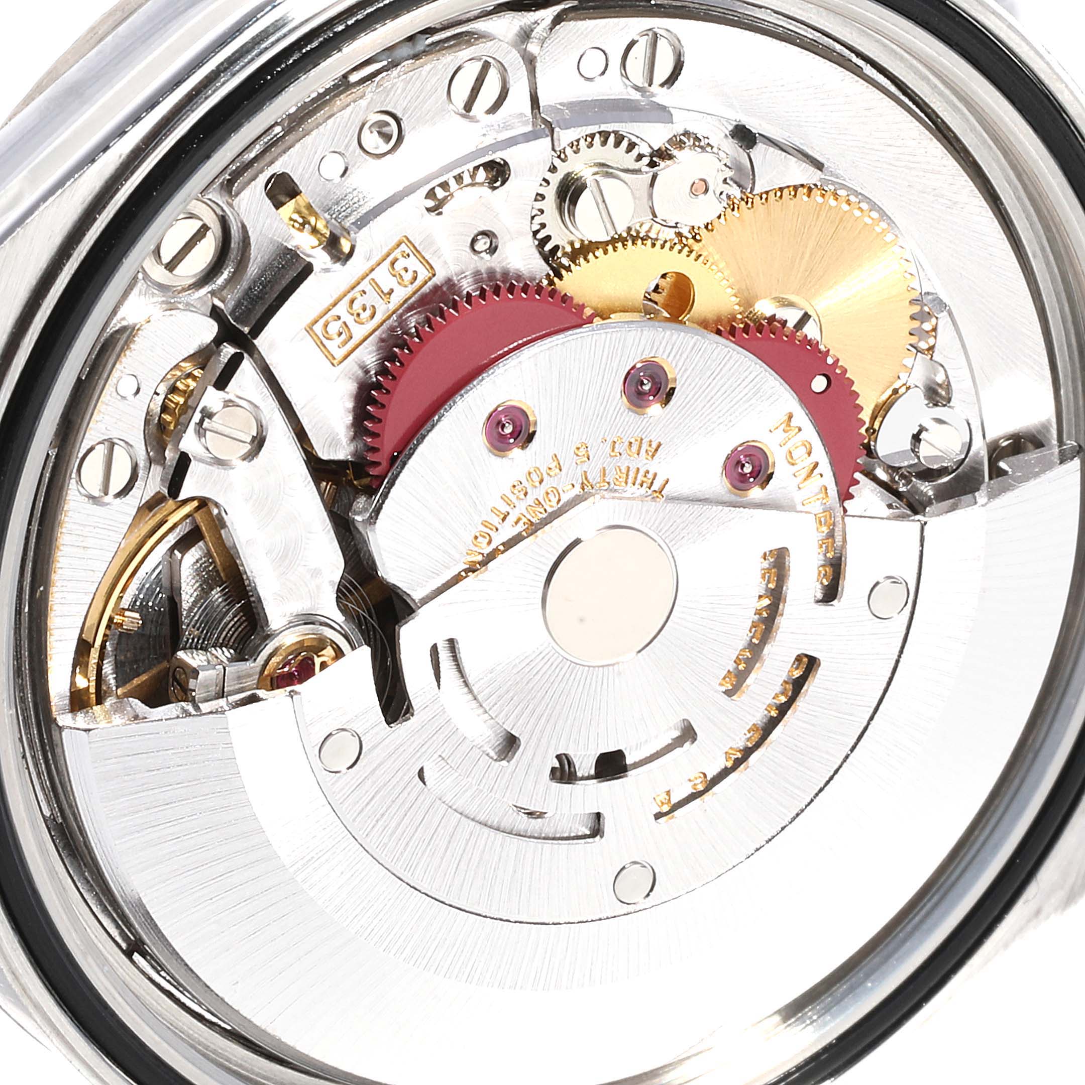 This image shows a close-up of the internal mechanism of a Rolex Datejust 16234 Men's Stainless Steel Silver Dial 16234 Men's Stainless Steel Silver Dial watch, highlighting the gears and rotor.