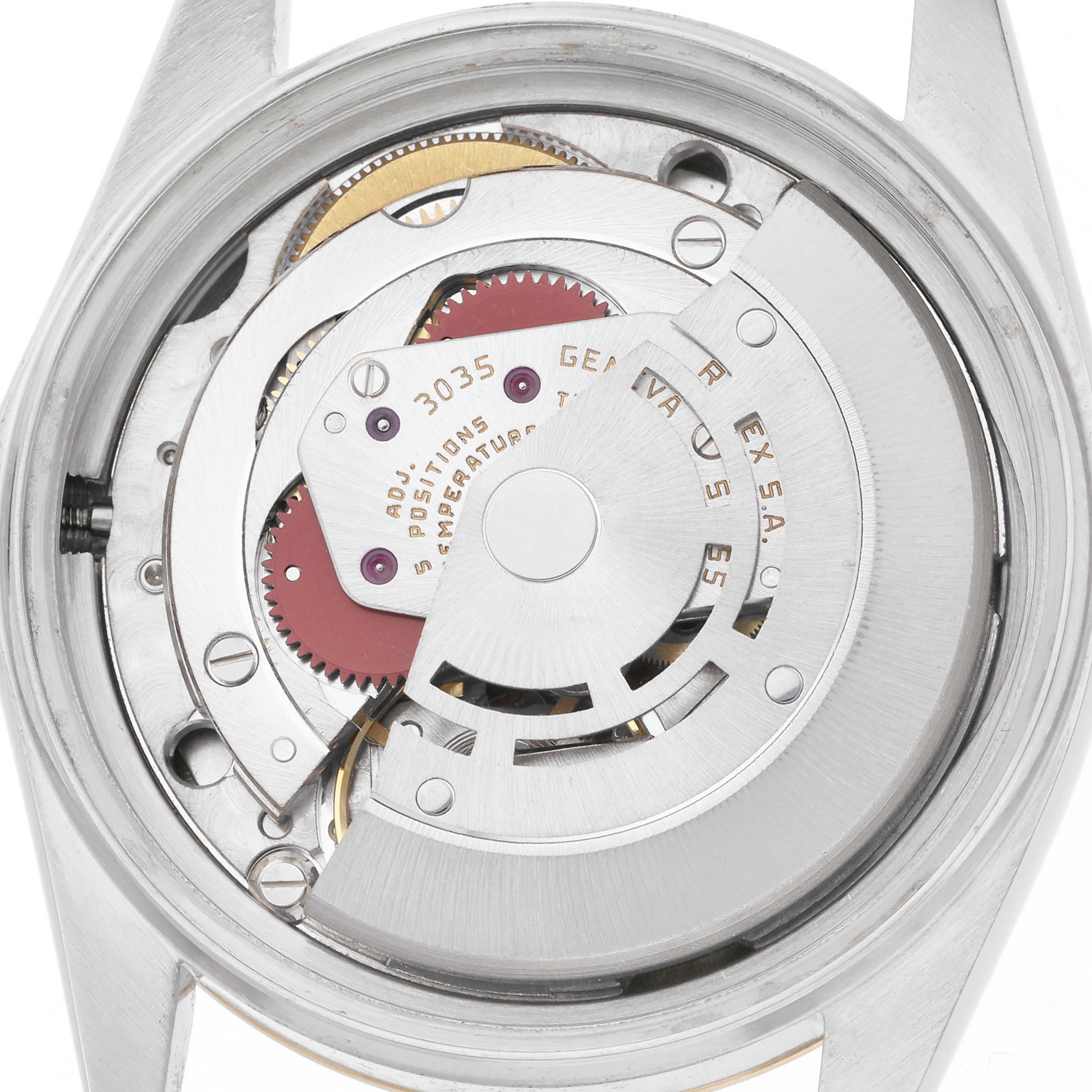 The image shows the movement of a Rolex Datejust, model 16013, viewed from the back, featuring the intricate inner mechanics.