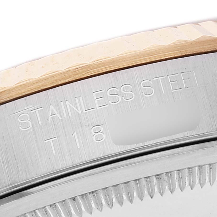 The image shows a close-up angle of the case and bezel with part of the inscription of a Rolex Datejust 16233 Men's Steel and Gold (two tone) Champagne Dial 16233 Men's Steel and Gold (two tone) Champagne Dial watch.