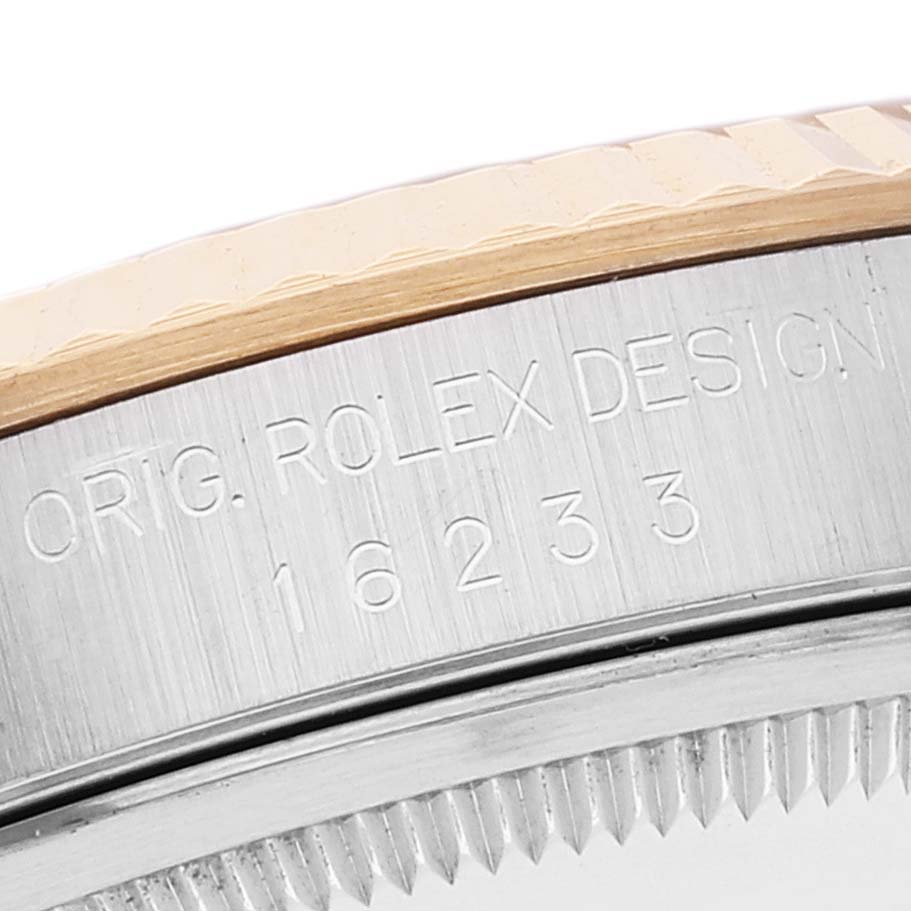 This image shows a close-up of the case side of a Rolex Datejust 16233 Men's Steel and Gold (two tone) Champagne Dial 16233 Men's Steel and Gold (two tone) Champagne Dial model, highlighting the engraved "ORIG. ROLEX DESIGN 16233."