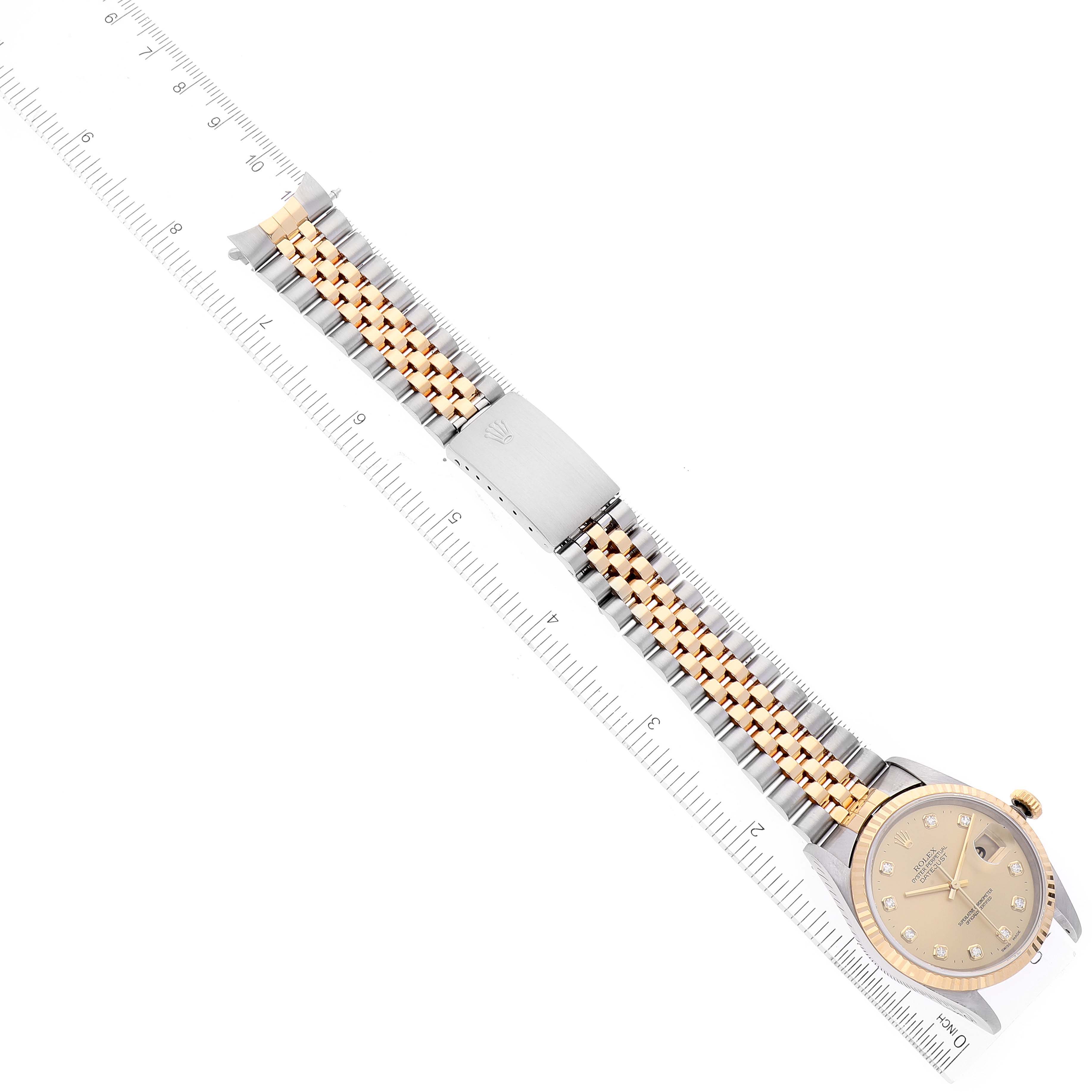 The image shows a Rolex Datejust 16233 Men's Steel and Gold (two tone) Champagne Dial 16233 Men's Steel and Gold (two tone) Champagne Dial watch laid flat with its two-tone bracelet extended, viewed from an overhead angle.
