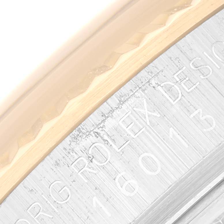 The image shows a close-up view of the outer edge and engraved text on the case back of the Vintage Collection model by Rolex.