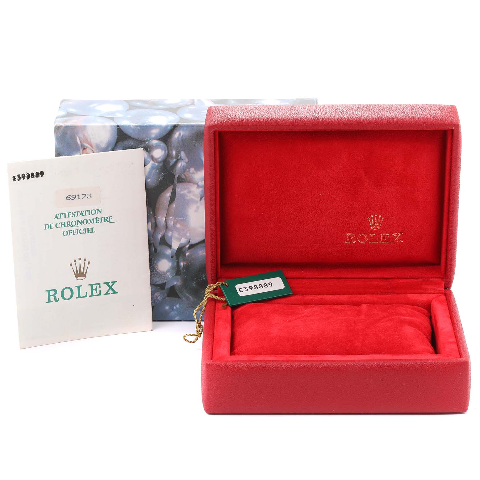 This image shows a red Rolex Datejust 69173 Women
s Steel and Gold (two tone) Champagne Dial 69173 Women
s Steel and Gold (two tone) Champagne Dial watch box, official chronometer certification, and tag with packaging.