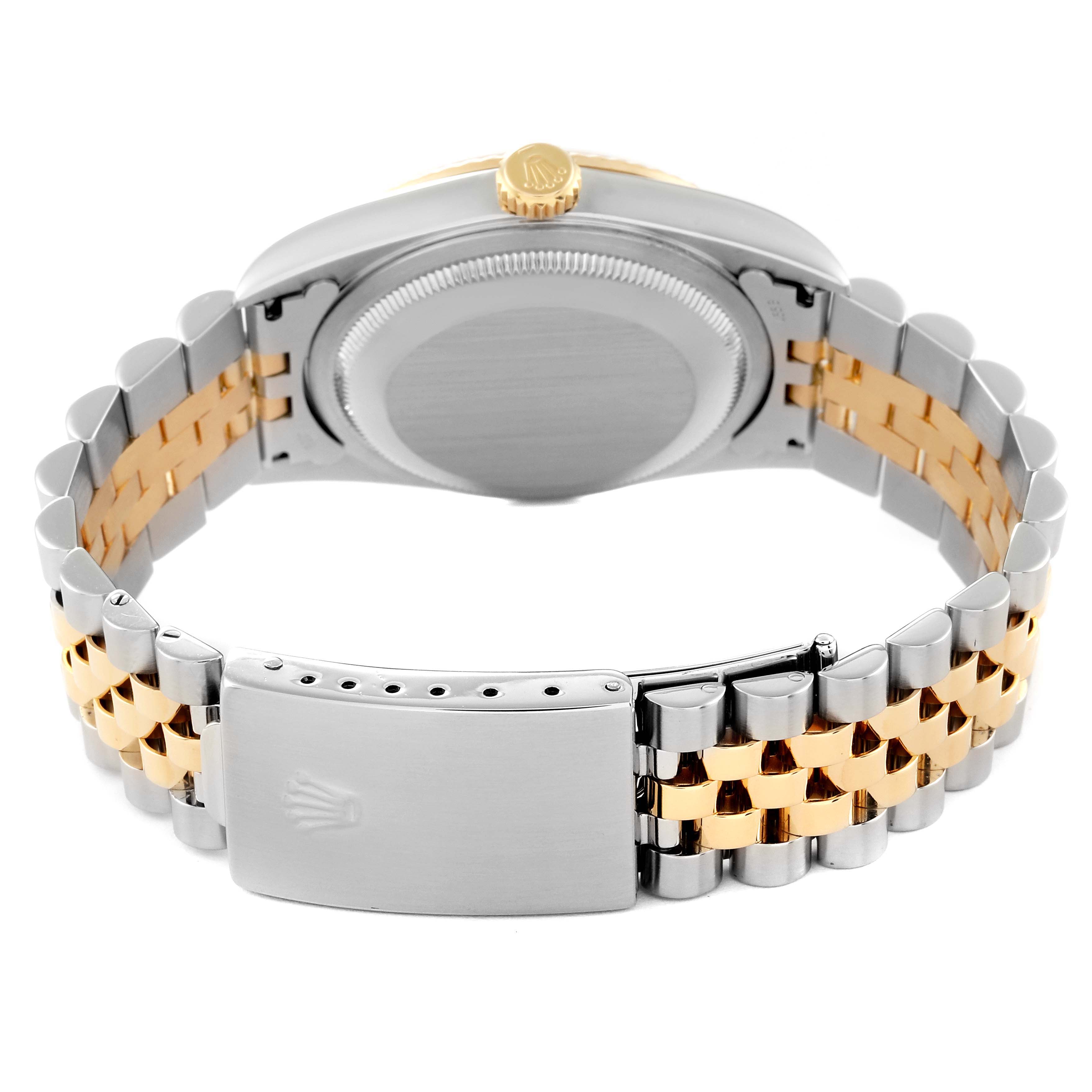 This image shows the underside of a Rolex Datejust 16233 Men's Steel and Gold (two tone) White Dial 16233 Men's Steel and Gold (two tone) White Dial watch, highlighting the bracelet, clasp, and back of the case.