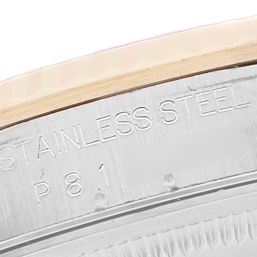 This close-up image shows the engraved "STAINLESS STEEL" marking on the bezel of a Rolex Datejust 16233 Men's Steel and Gold (two tone) White Dial 16233 Men's Steel and Gold (two tone) White Dial watch.