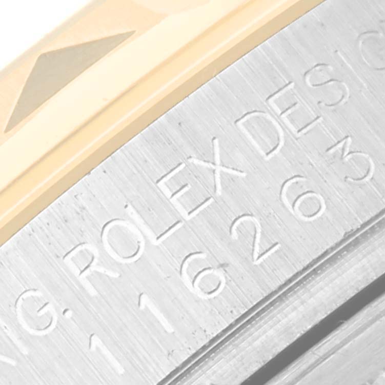 The image shows a close-up of the bezel and case with engraved text of a Rolex Turn-o-Graph 116263 Men's Steel and Gold (two tone) White Dial 116263 Men's Steel and Gold (two tone) White Dial watch.