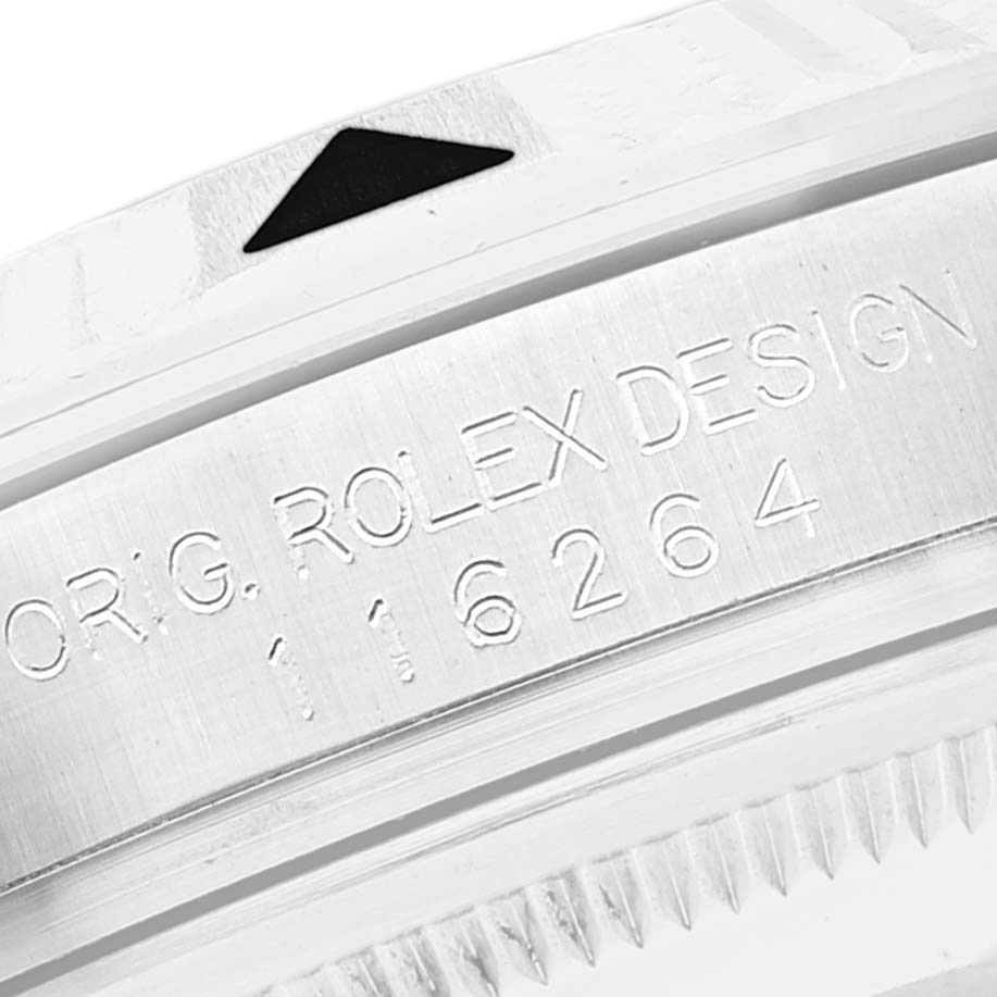 This image shows a close-up of the Rolex Turn-o-Graph 116264 Men's Stainless Steel Black Dial 116264 Men's Stainless Steel Black Dial model's bezel and part of the serial number engraved on the case.