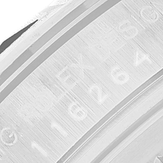 This image shows a close-up of the engraved numbers and the brand name on the inner bezel of a Rolex Turn-o-Graph 116264 Men's Stainless Steel Black Dial 116264 Men's Stainless Steel Black Dial model.
