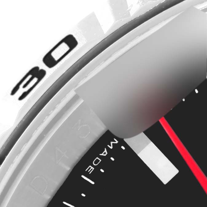 This close-up image of a Rolex Turn-o-Graph 116264 Men's Stainless Steel Black Dial 116264 Men's Stainless Steel Black Dial watch focuses on the bezel and part of the dial, showing the '30' mark and a red second hand.
