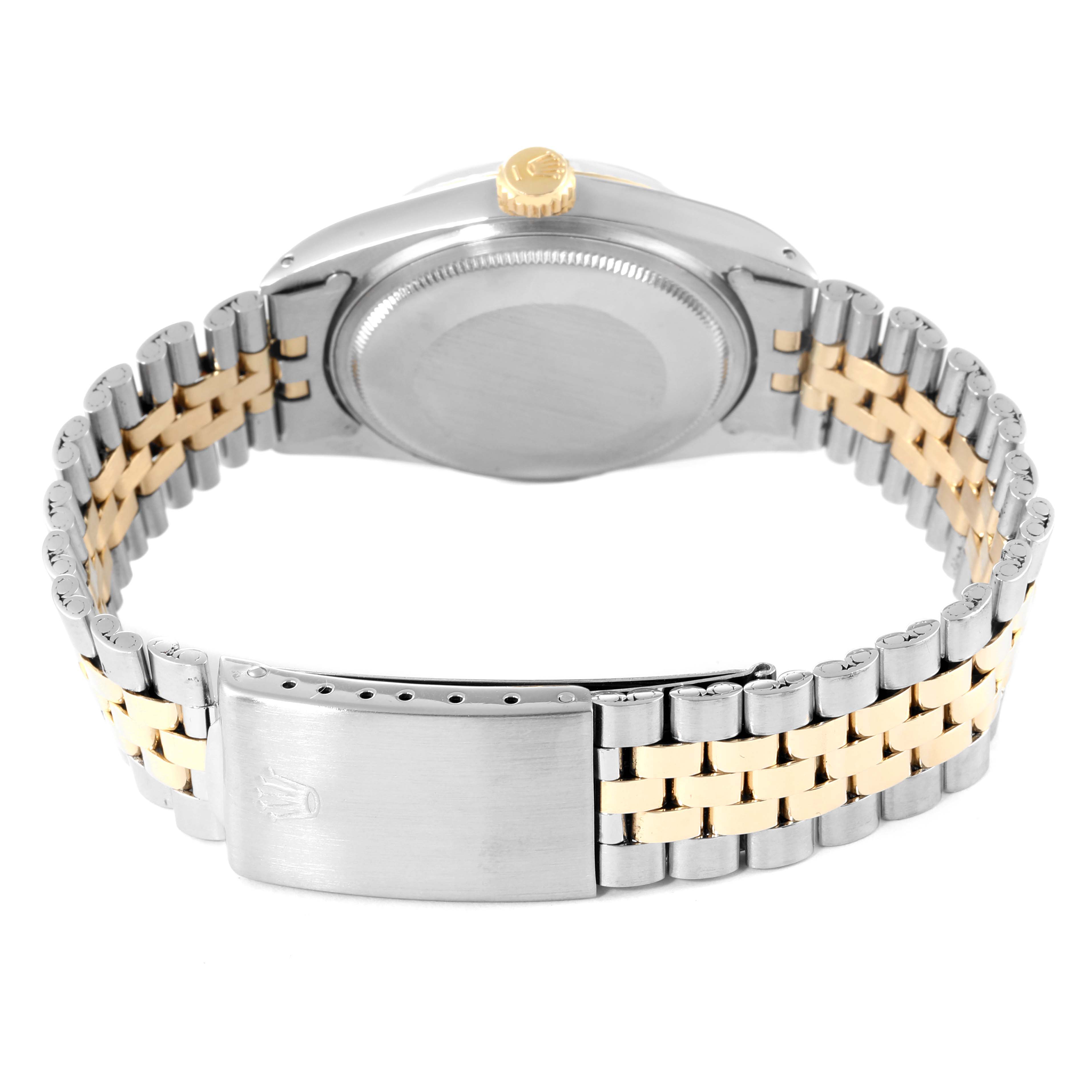 The image shows the back view of a Rolex Datejust 1601 Men
s Steel and Gold (two tone) Champagne Dial 1601 Men
s Steel and Gold (two tone) Champagne Dial watch, highlighting the case back, crown, and two-tone bracelet with the clasp.