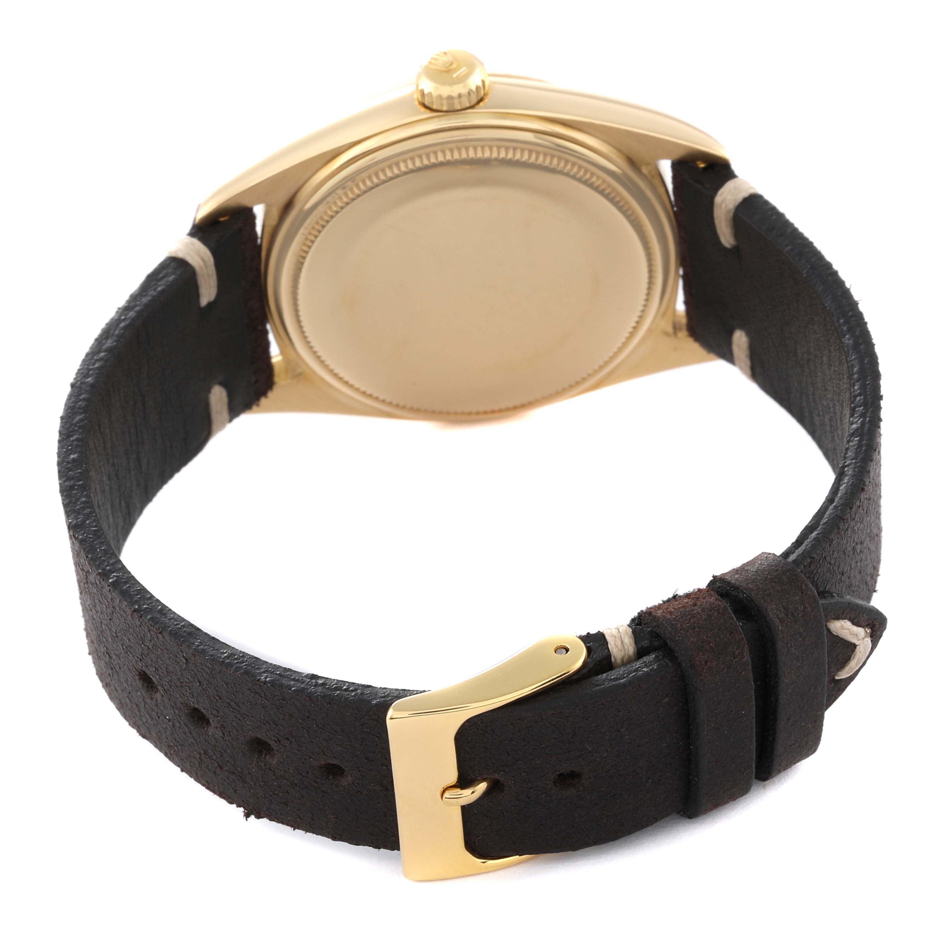 The image shows the back case and leather strap of a vintage Rolex Vintage Collection 1601 Men's Yellow Gold Champagne Dial 1601 Men's Yellow Gold Champagne Dial watch from a rear angle.