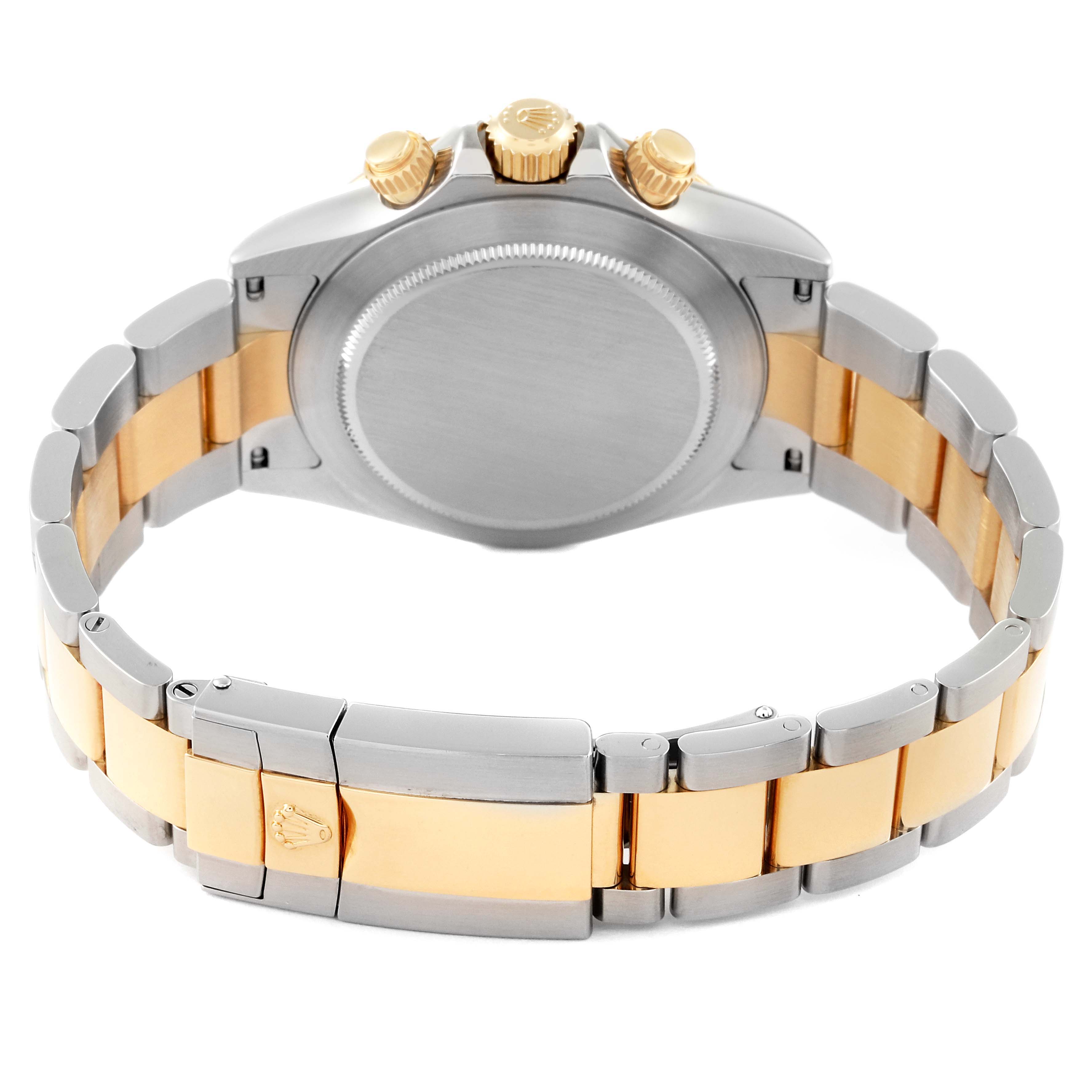 The image shows the back case, crown, pushers, and bracelet of a Rolex Daytona 116523 Men
s Steel and Gold (two tone) Black Dial 116523 Men
s Steel and Gold (two tone) Black Dial watch.