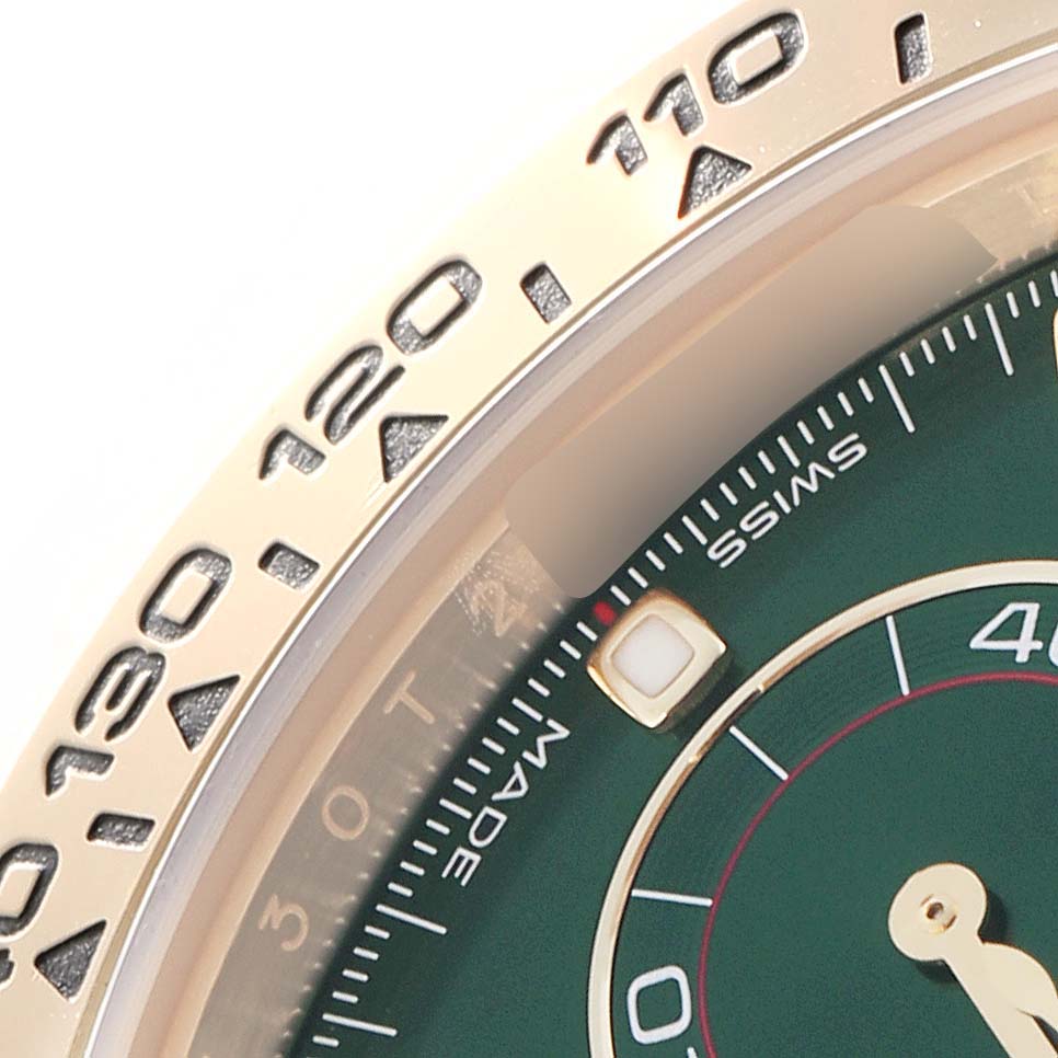 The image shows a close-up of the bezel and partial dial of the Rolex Daytona 116508 men
s watch, highlighting the tachymeter scale and part of the green dial.