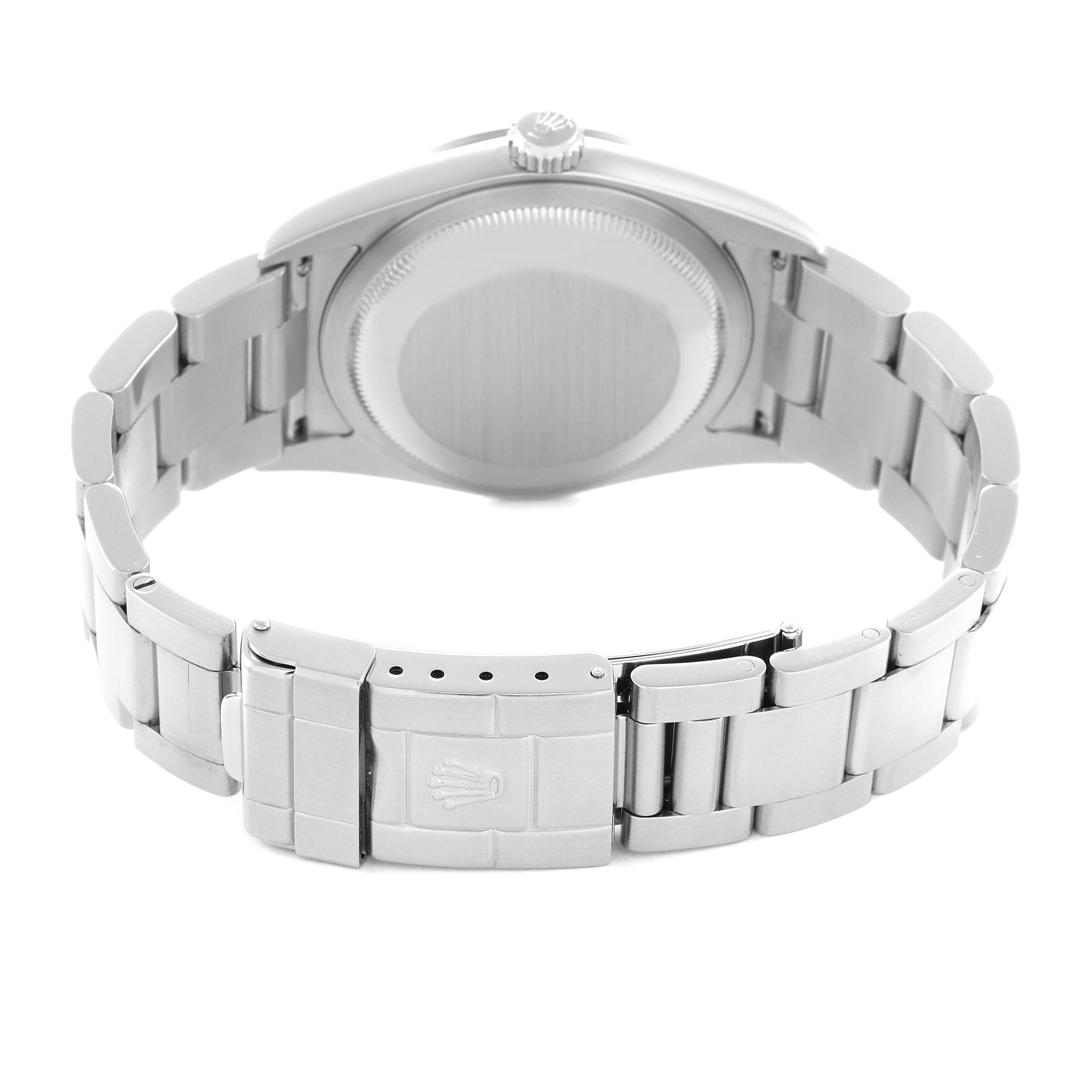 The image shows the back view of a Rolex Explorer model 114270 men
s watch, highlighting the case back and the clasp of the metal bracelet.