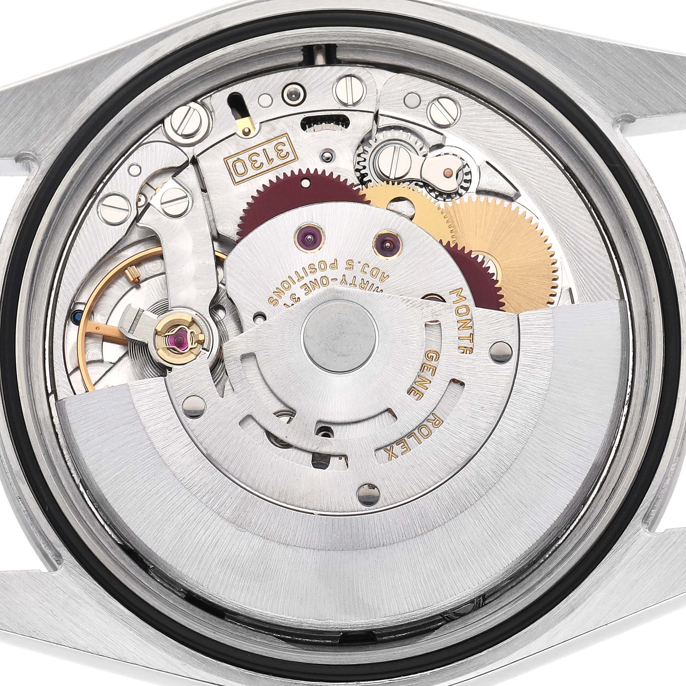 The image shows the movement of a Rolex Explorer model 114270, featuring gears and components viewed from the back.