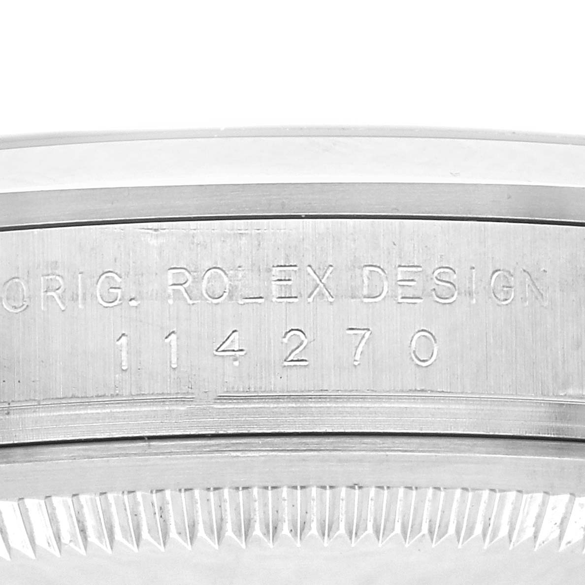 The image shows a close-up side view of a Rolex Explorer watch model 114270, focusing on the engraved "ORIG. ROLEX DESIGN 114270" marking on the case.
