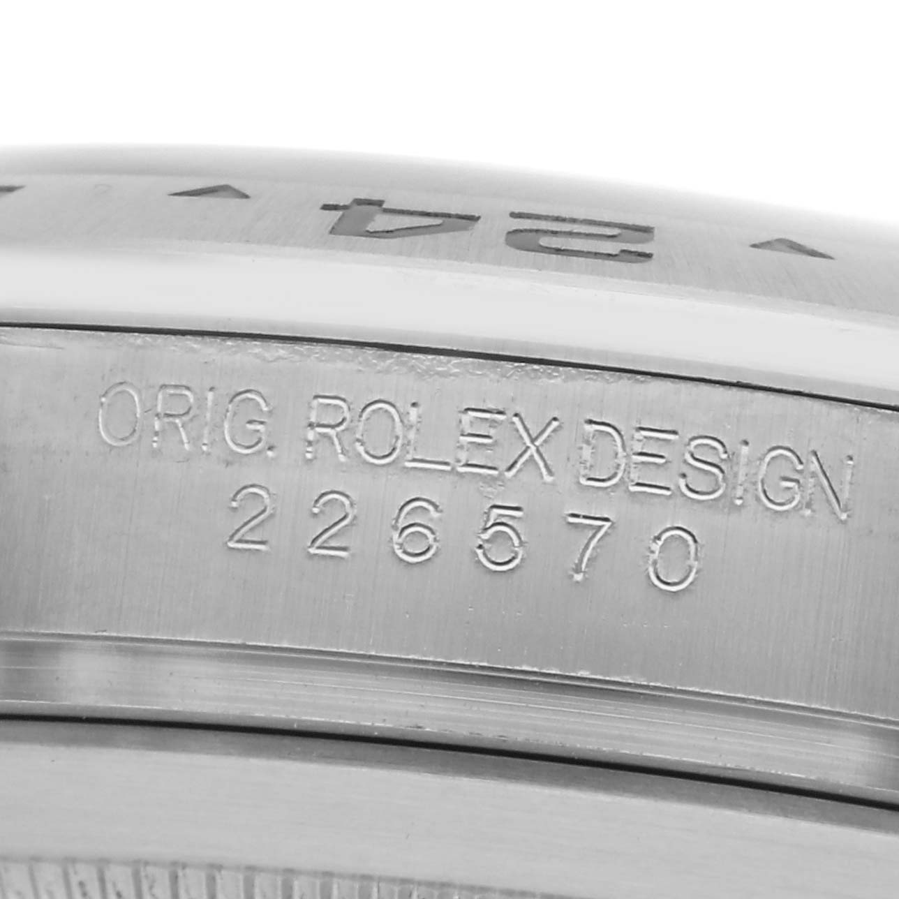 The image shows a close-up of the side of the Rolex Explorer 226570, displaying the engraved model number "226570" and "ORIG. ROLEX DESIGN."