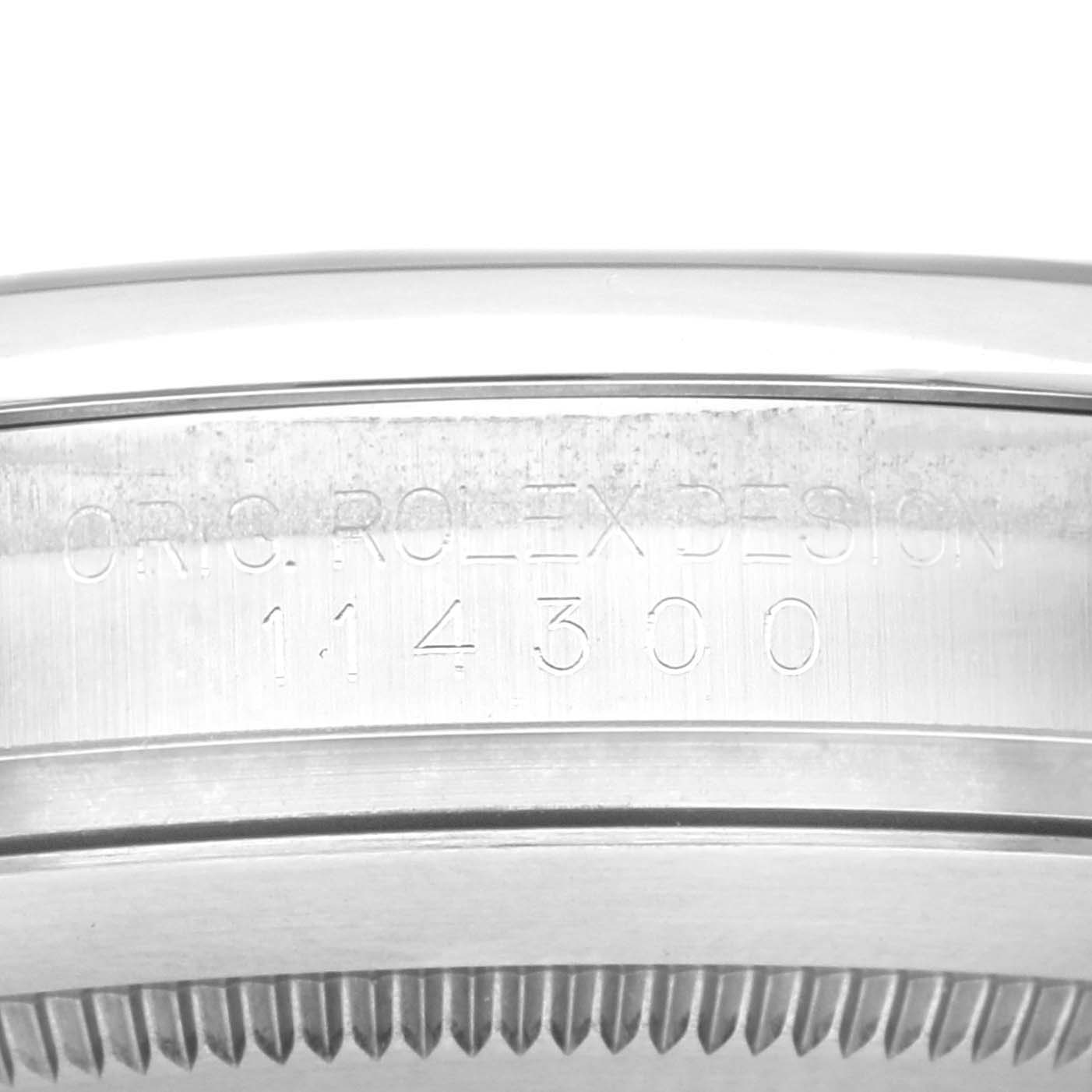 The image shows the side engraving of a Rolex Oyster Perpetual, model 114300.