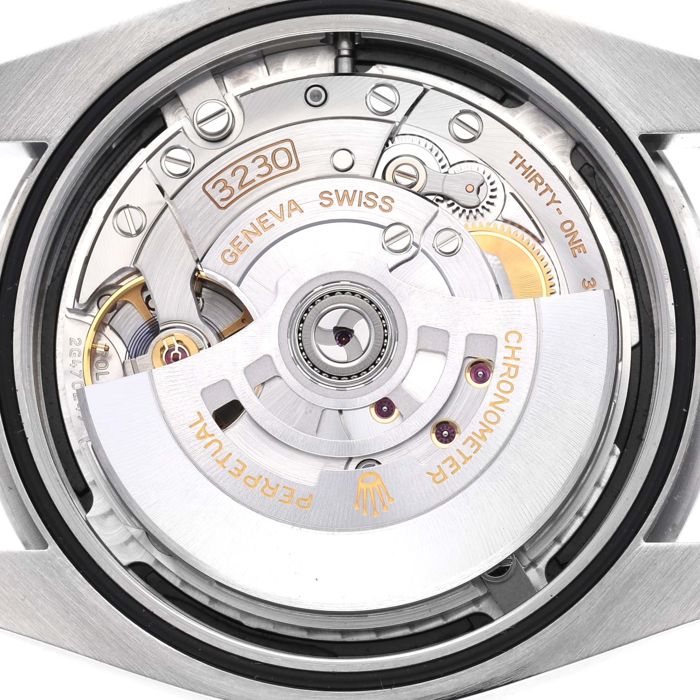 The image shows the movement of the Rolex Oyster Perpetual watch, model number 124300, from a top-down angle, highlighting the intricate mechanics and engravings.