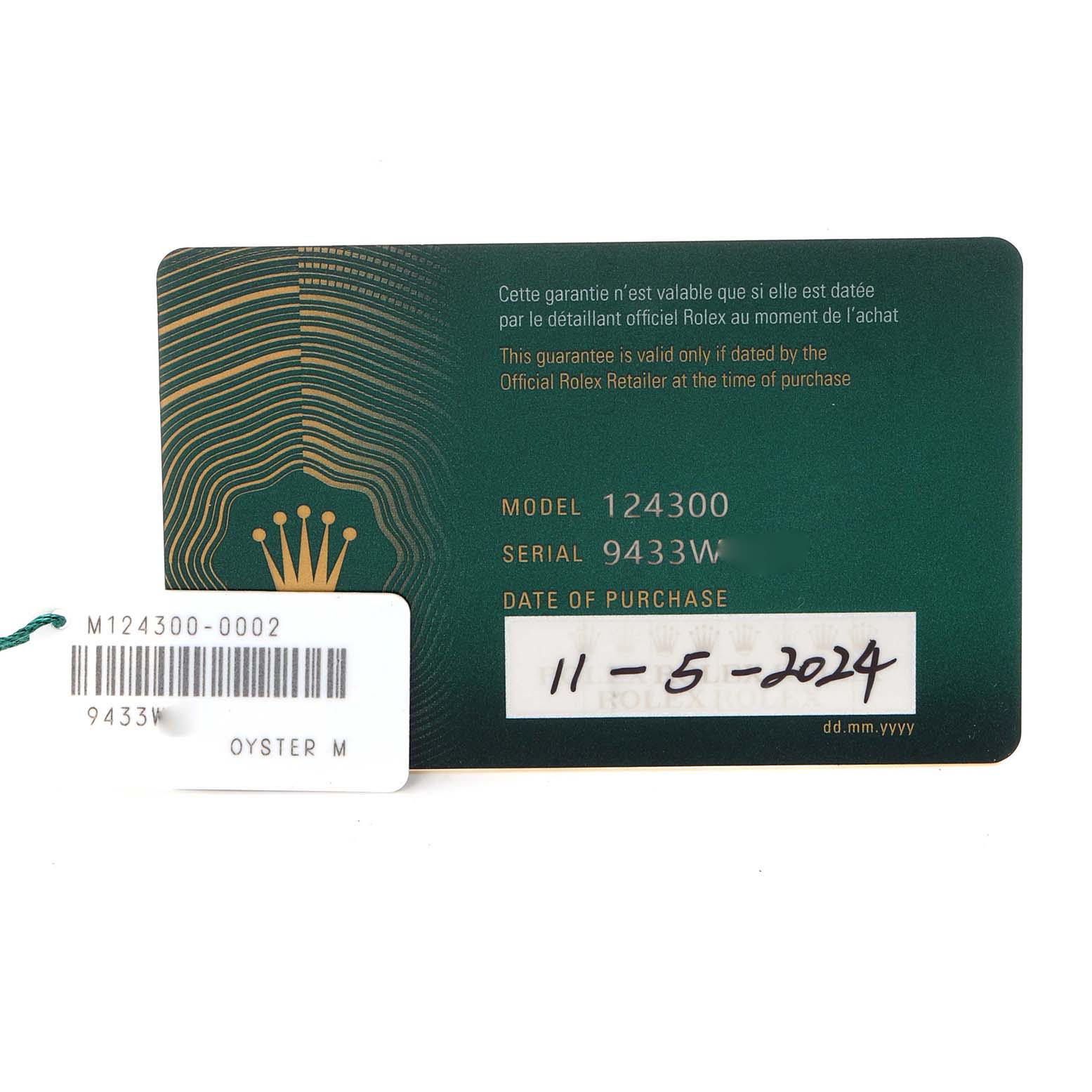 The image shows a warranty card and a tag for the Rolex Oyster Perpetual, model 124300, with accompanying model number and purchase date information.